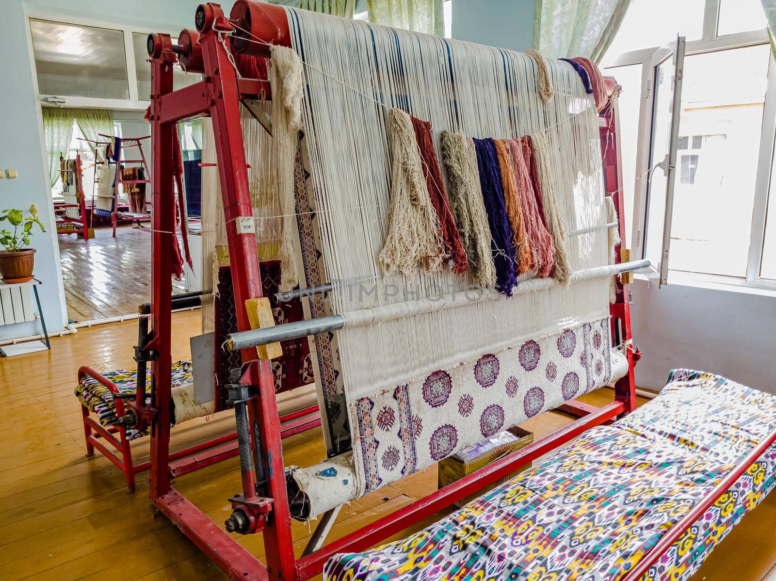 Workshop for the manual production of silk carpets in Central Asia. Uzbekistan.