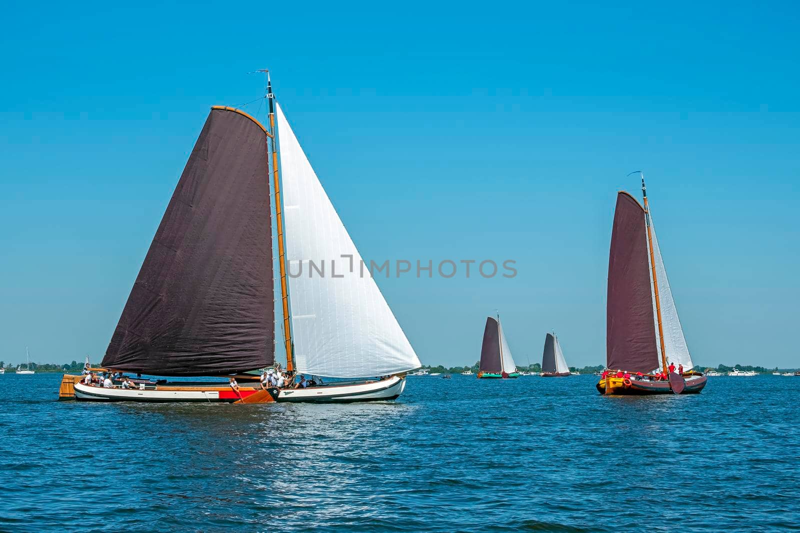 Traditional Frisian wooden sailing ships in a yearly competition in the Netherlands