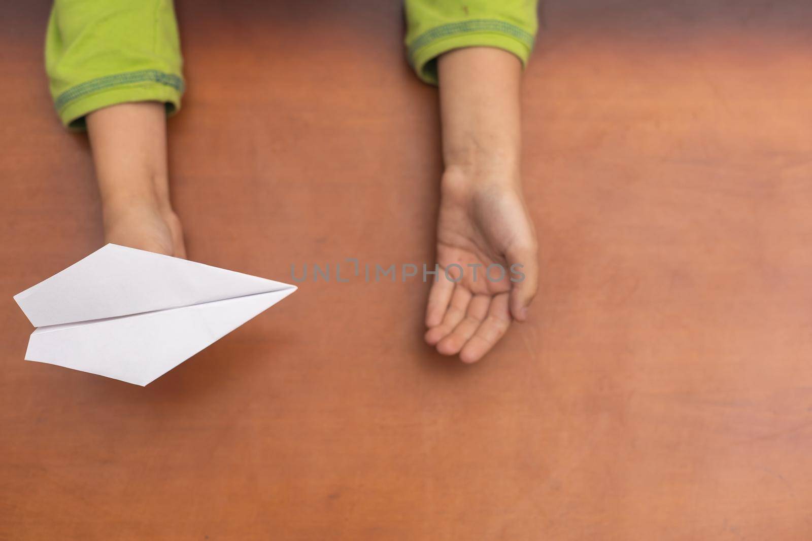 paper airplane in children's hands. by Andelov13