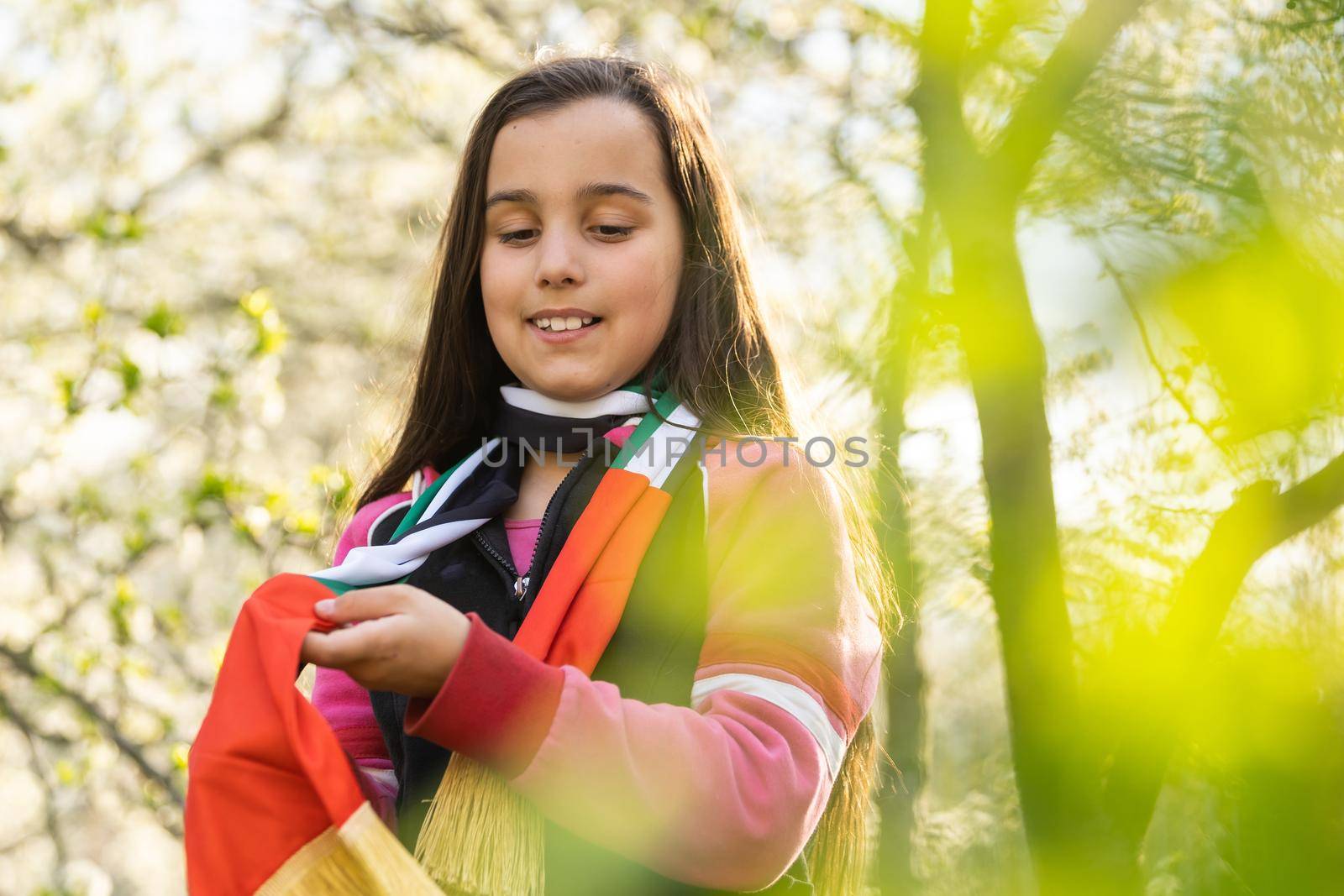 United Arab Emirates concept with happy child girl with red the United Arab Emirates flag. Learn Arabic language by Andelov13