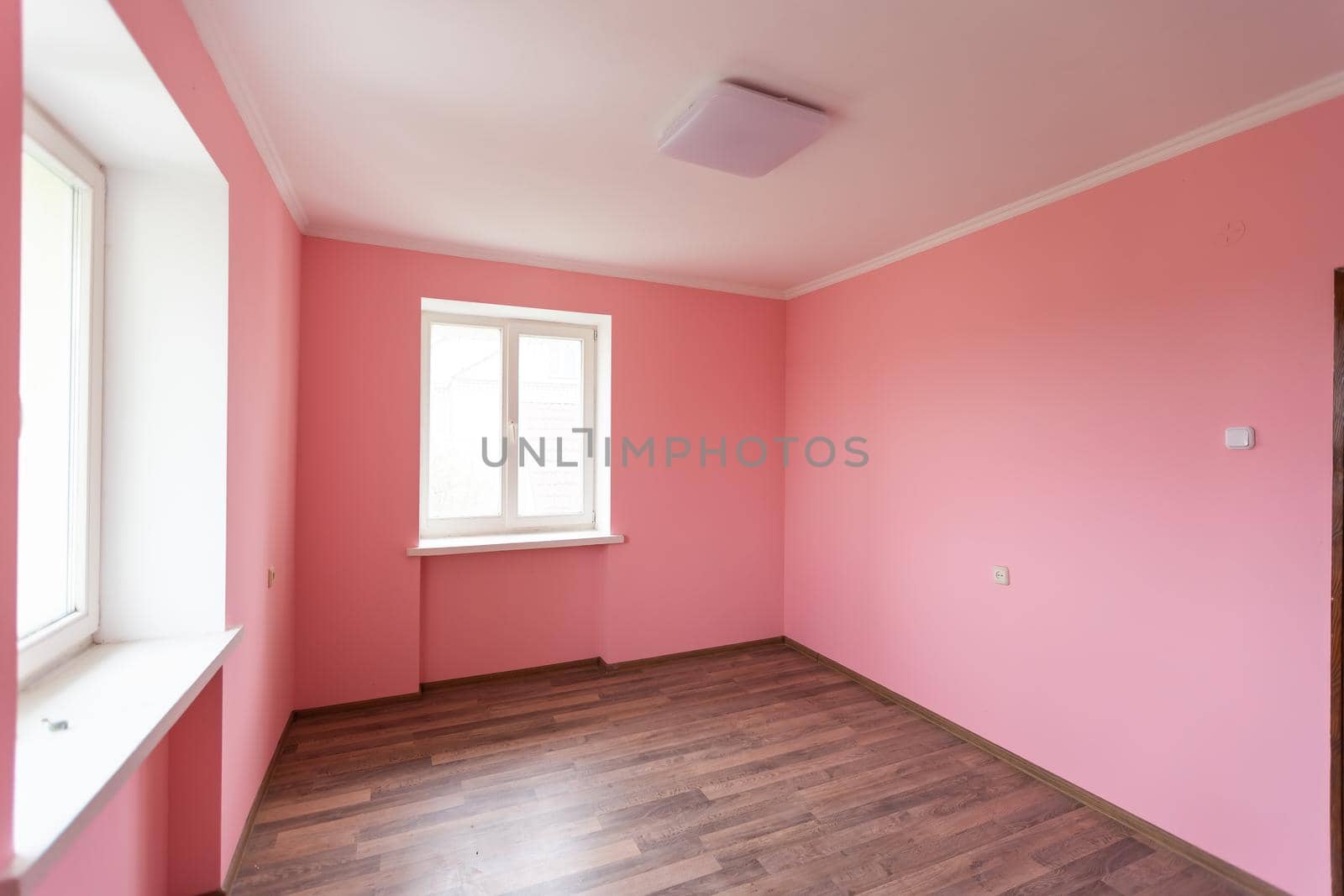 light pink color wall with modern lamp and empty concept and frame. by Andelov13