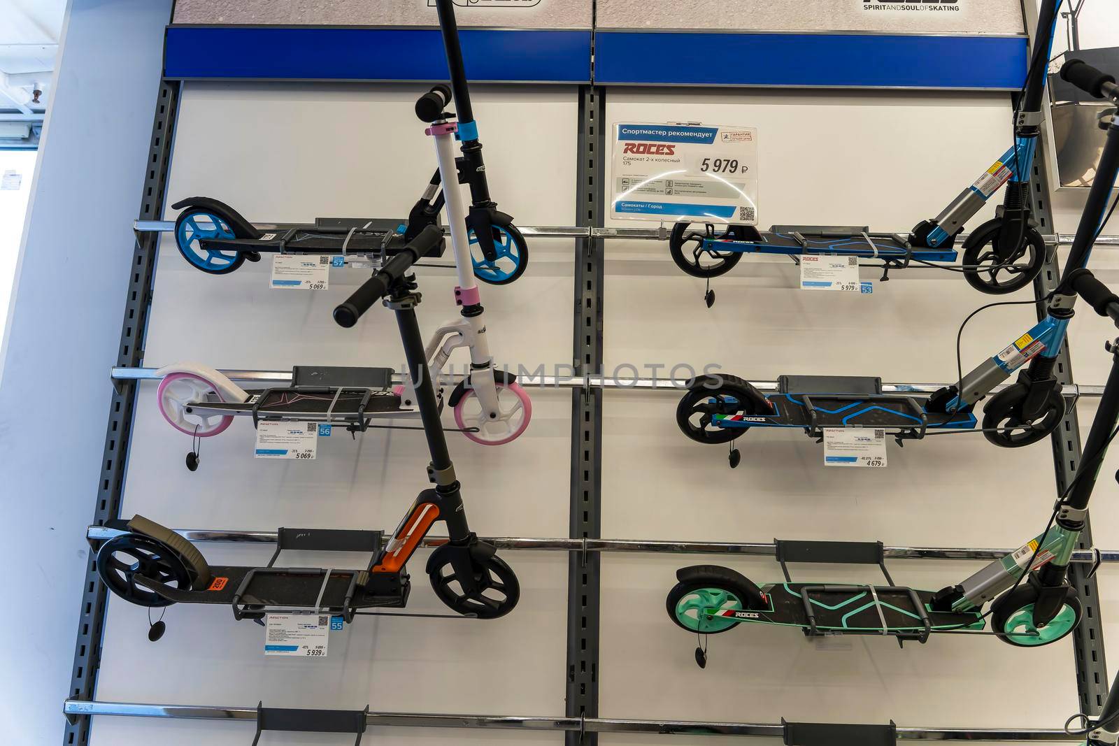 SAINT PETERSBURG, RUSSIA - AUGUST 14, 2022: new scooters on the shelf of a sporting goods store. colorful sports equipment in the sports store