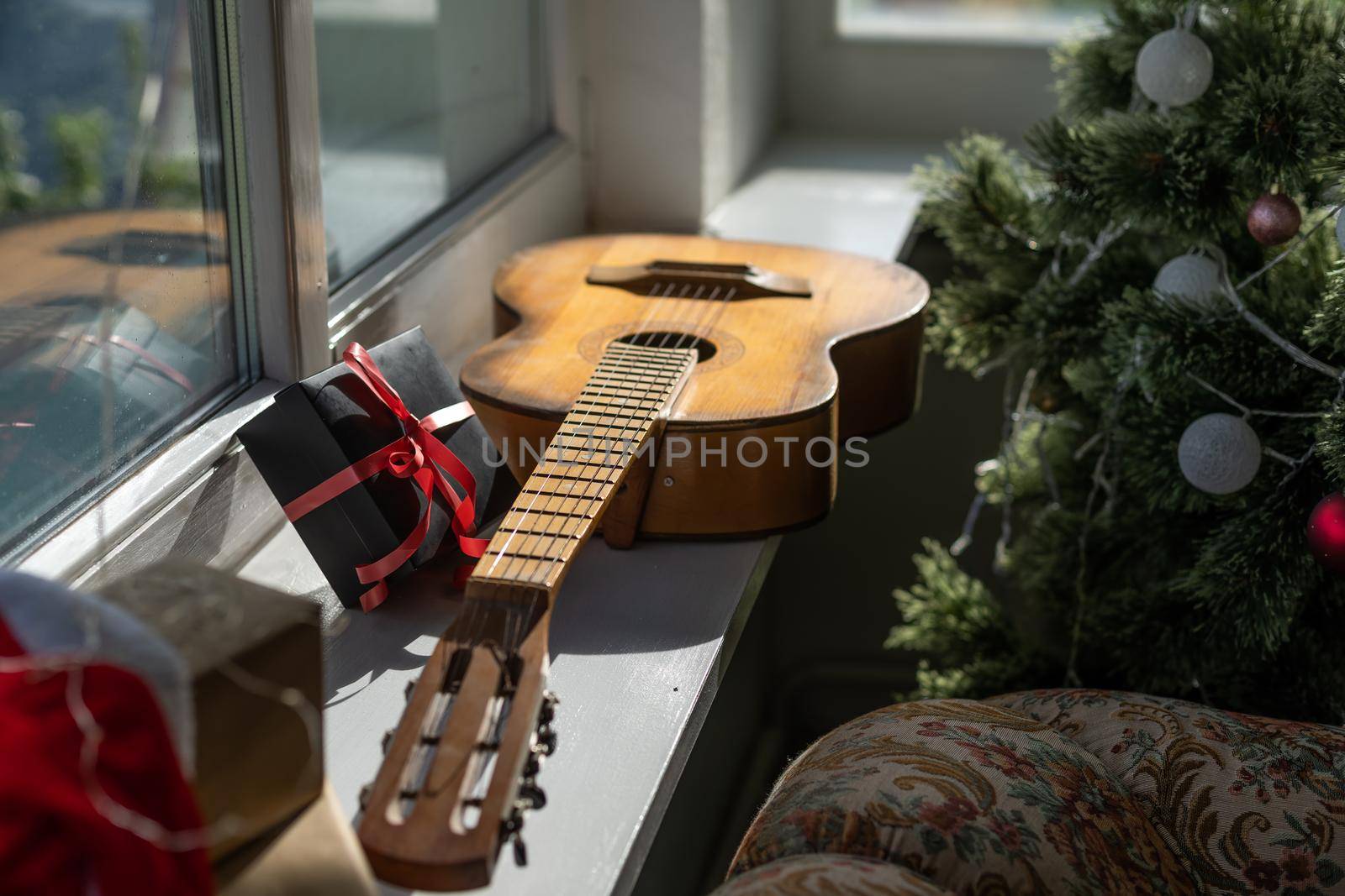 Flat lay composition with guitar and Santa hat, space for text. Christmas music by Andelov13