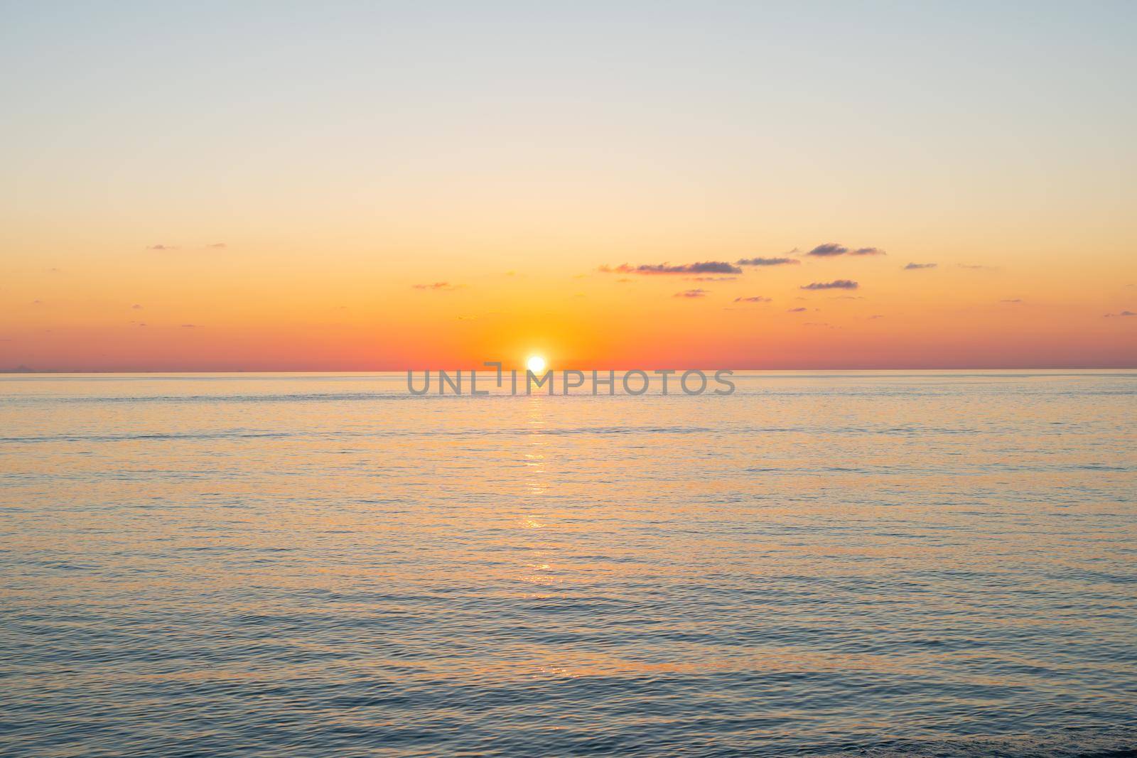 Sunset over the Black Sea. Beautiful seascape from the shore.