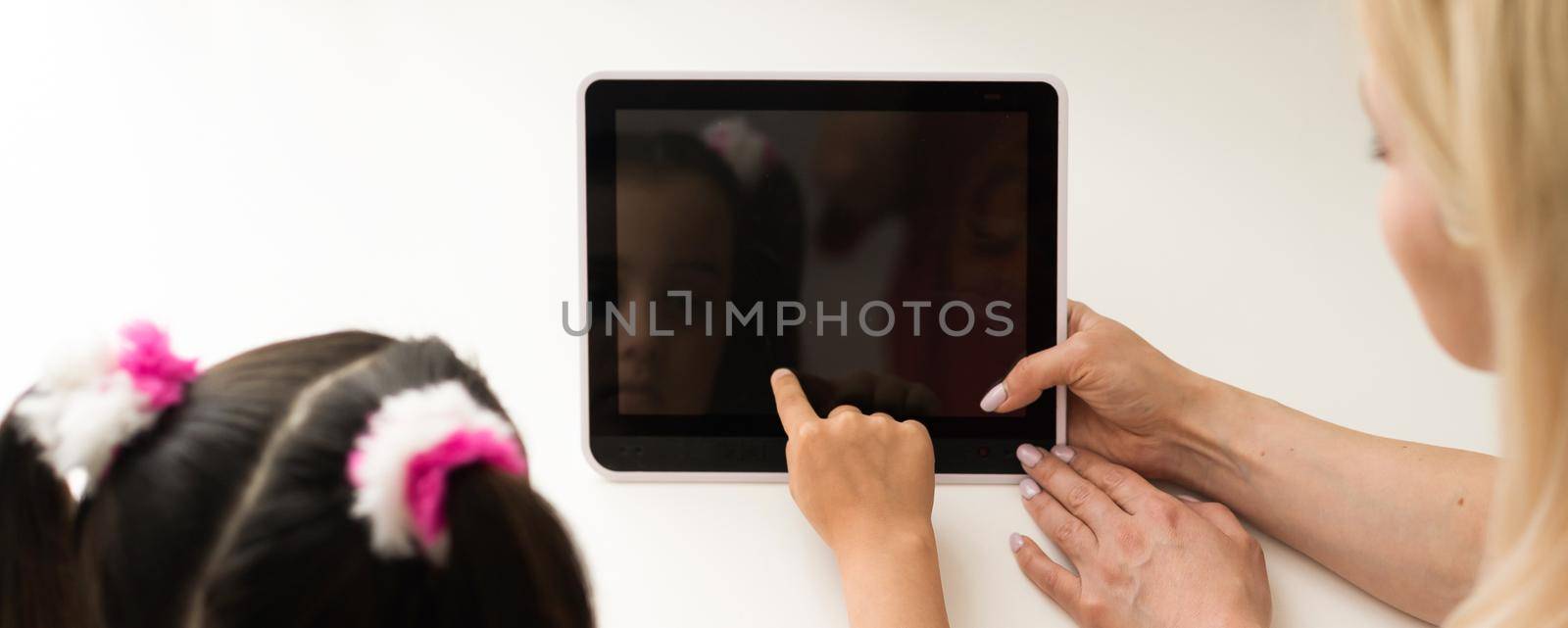 picture of mother and daughter with tablet pc.