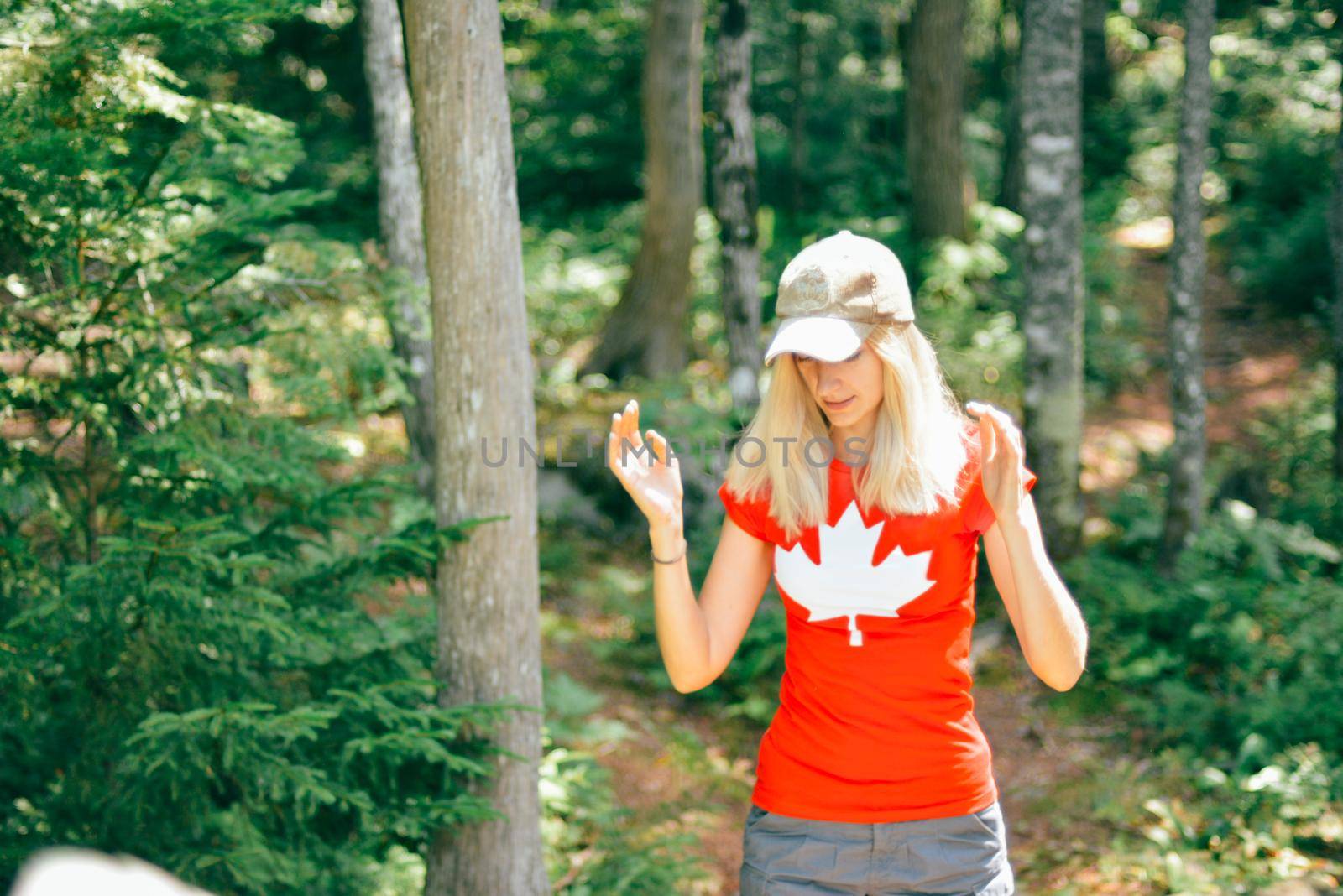 Girl in a T-shirt with a maple leaf