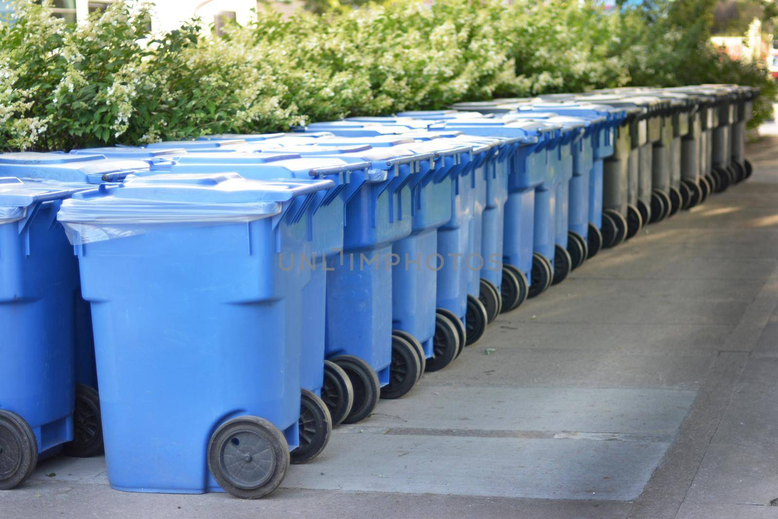 Modern blue grey garbage bin in Canada.