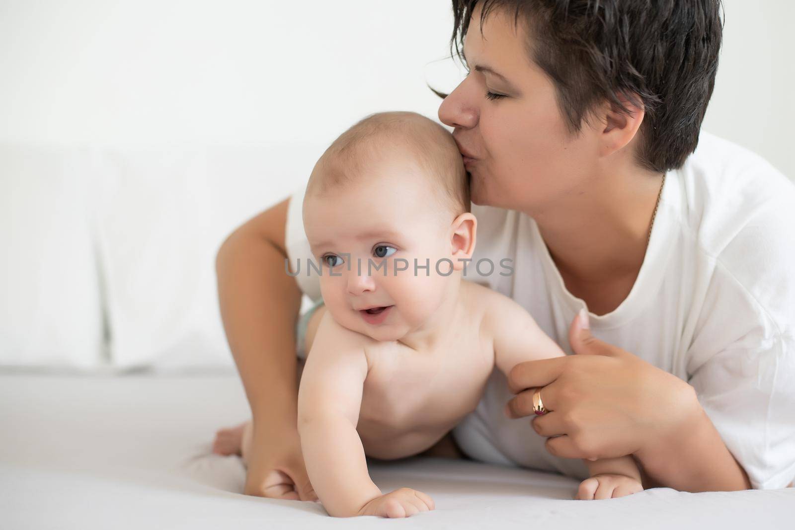 Portrait of a mother with her 6 months old baby, top view point.
