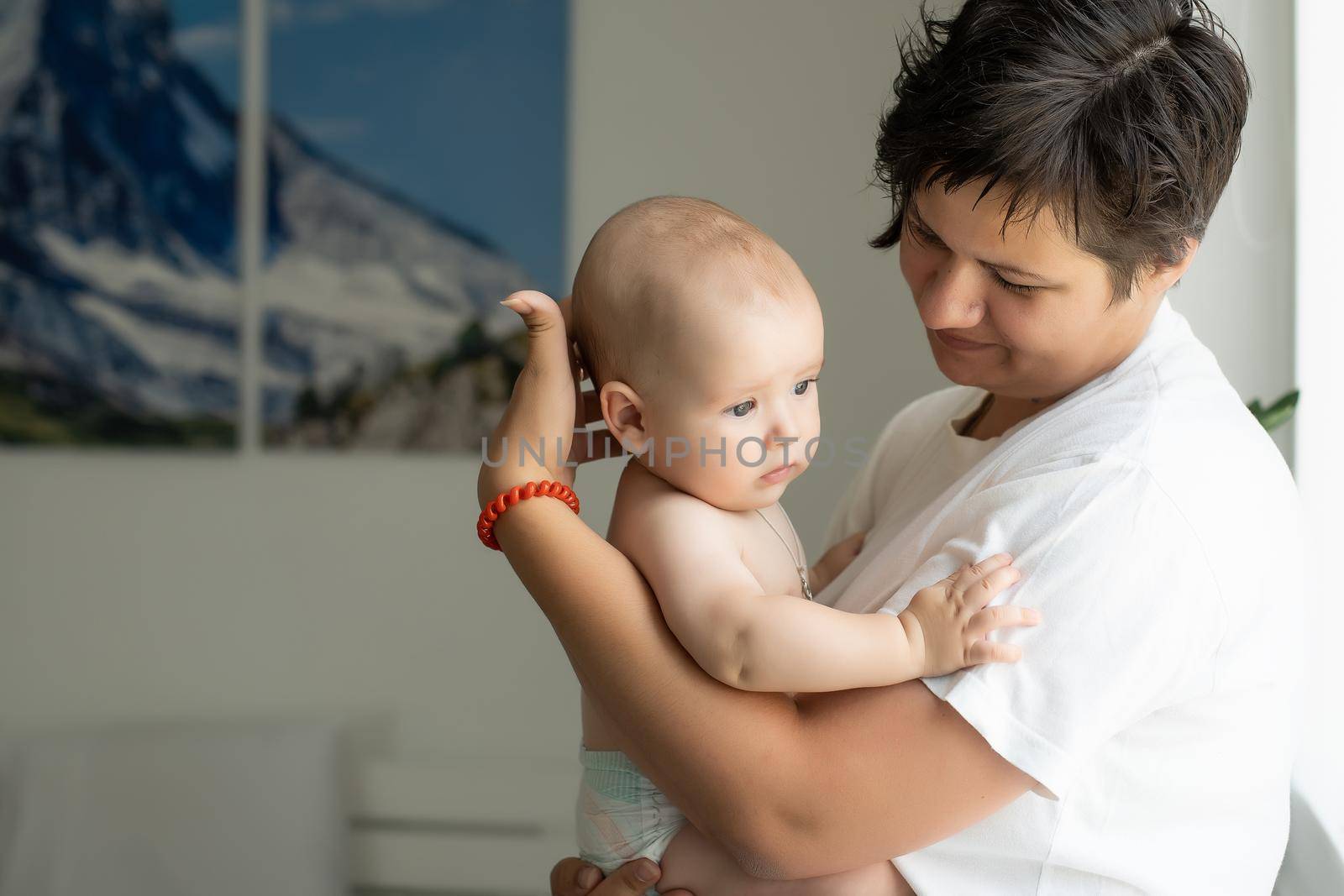 Portrait of a mother with her 6 months old baby, top view point.