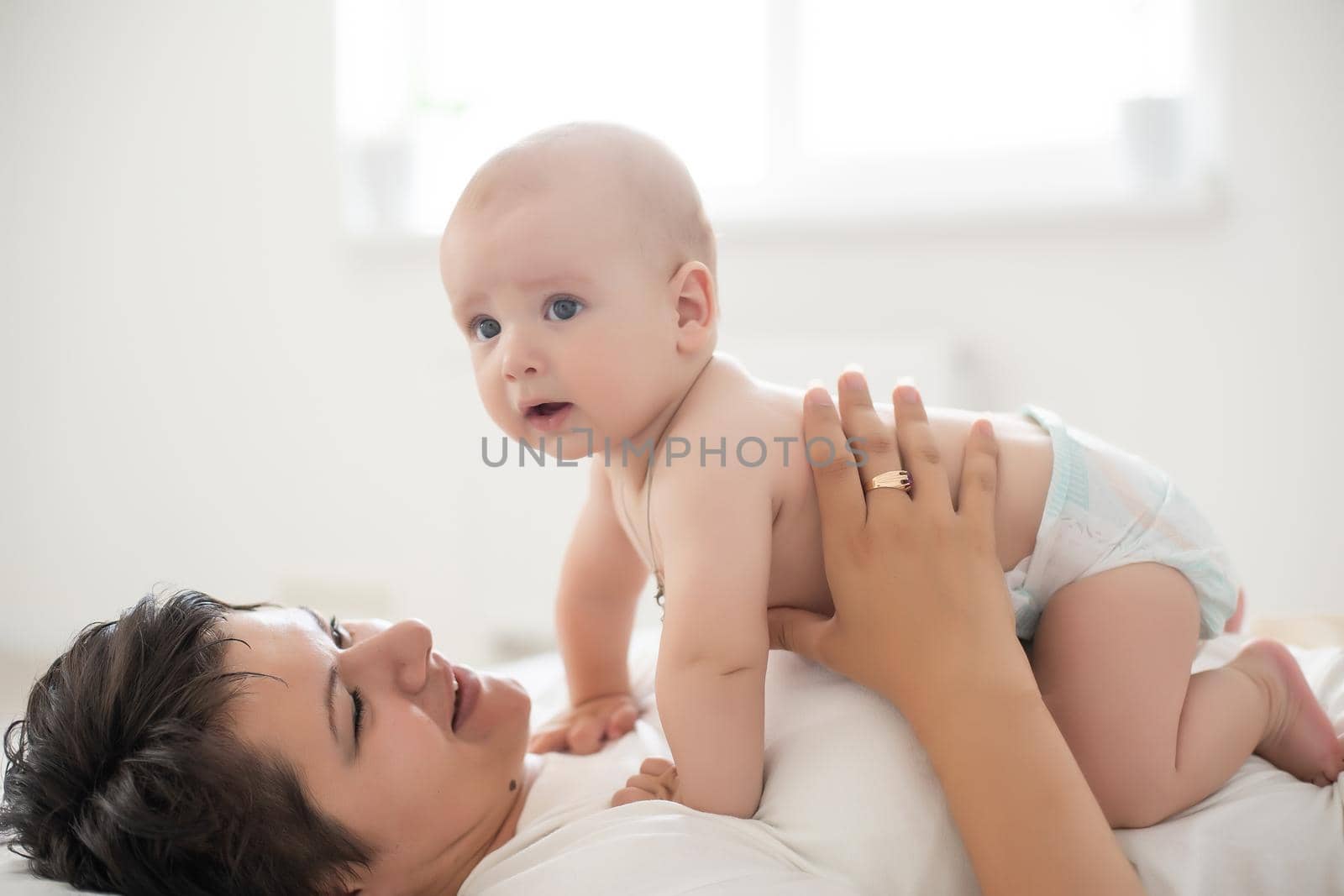 picture of happy mother with baby in hands.