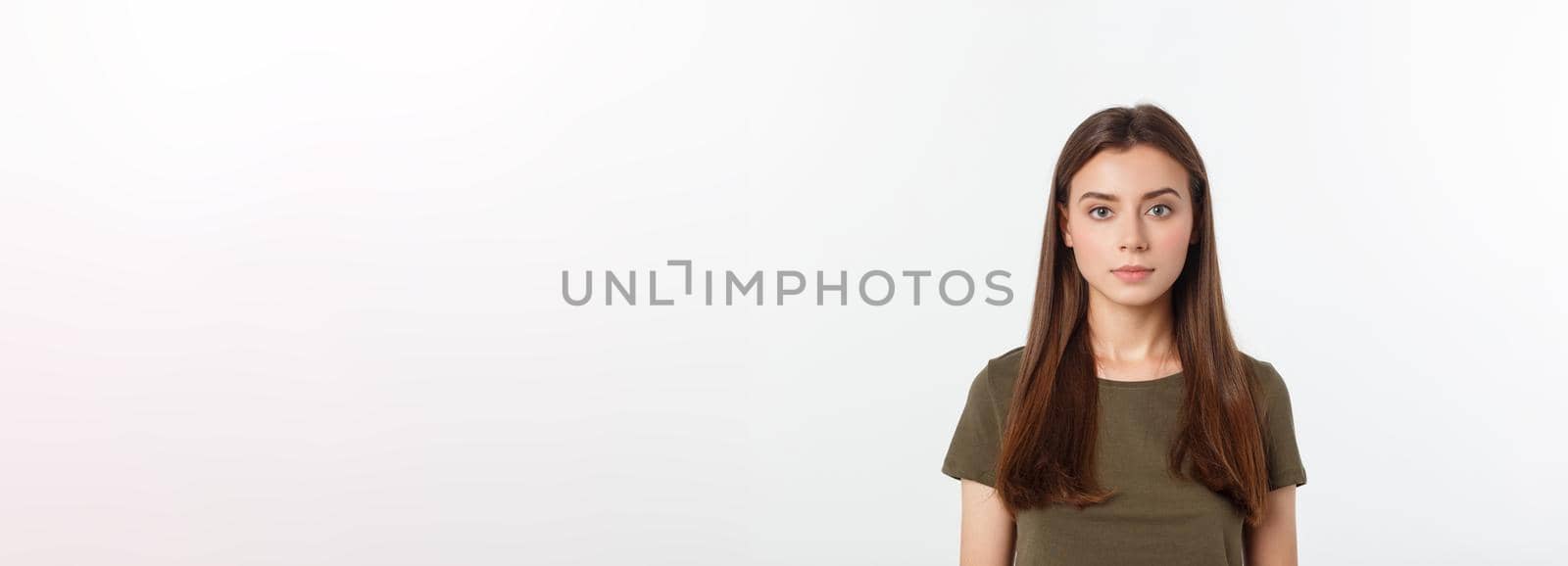 Portrait of a beautiful young woman looking at the camera and smiling, isolated on a white background. by Benzoix