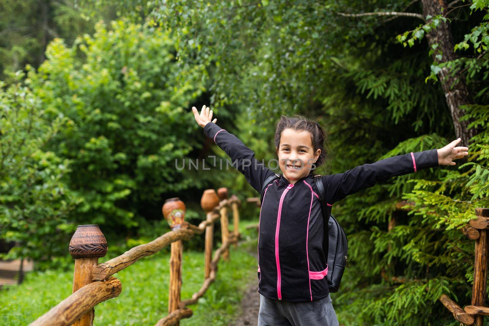 little girl with a backpack going to school. by Andelov13