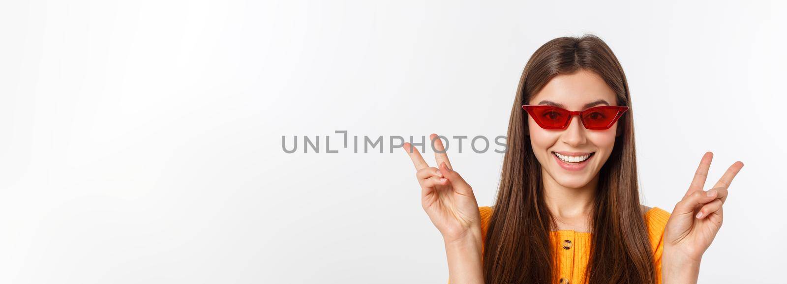 Fashion girl hipster in glasses. White background isolated. by Benzoix