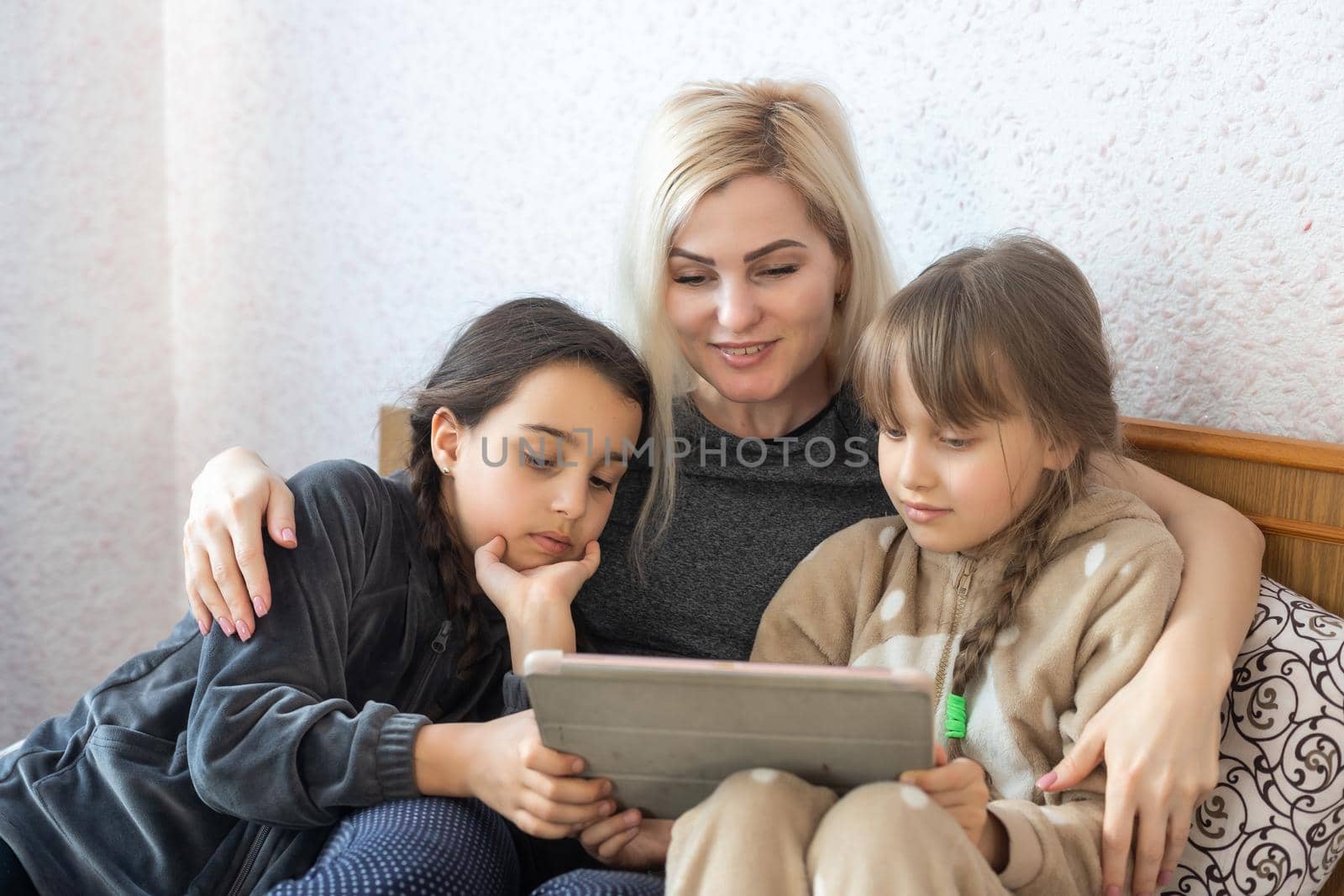 Mother with two children using Tablet PC by Andelov13