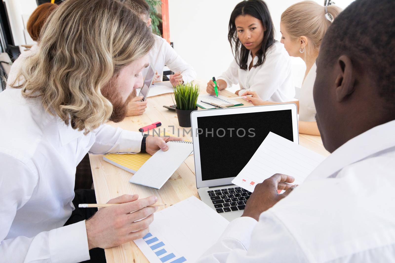 Diversity Teamwork Brainstorming Meeting Concept.Business Team Coworker Global Sharing Economy Laptop Graph. People Working Planning Start Up.Group Young Man Women Looking Report Office