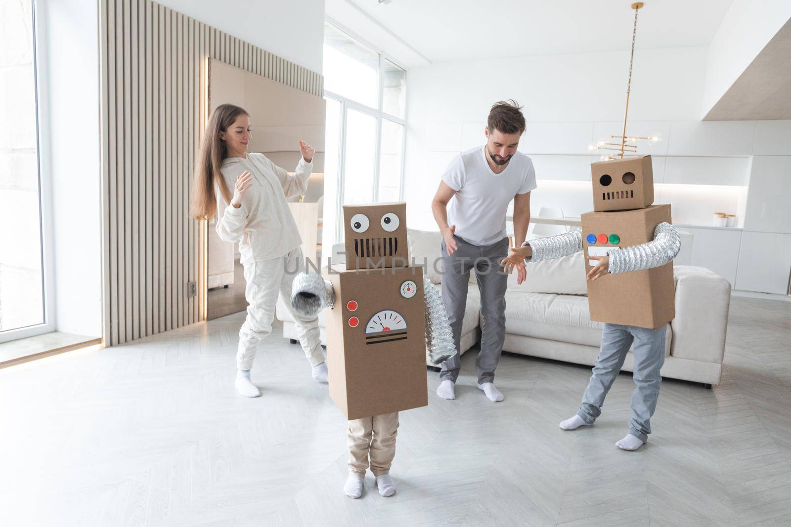 Family playing robots at home by ALotOfPeople