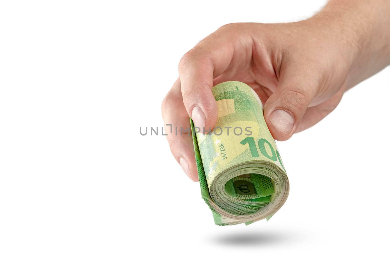 Money in hand isolate on white. The hand holds a roll of 100 euro banknotes. Euro banknotes rolled up in hand isolated on white background. The concept of financial assistance.