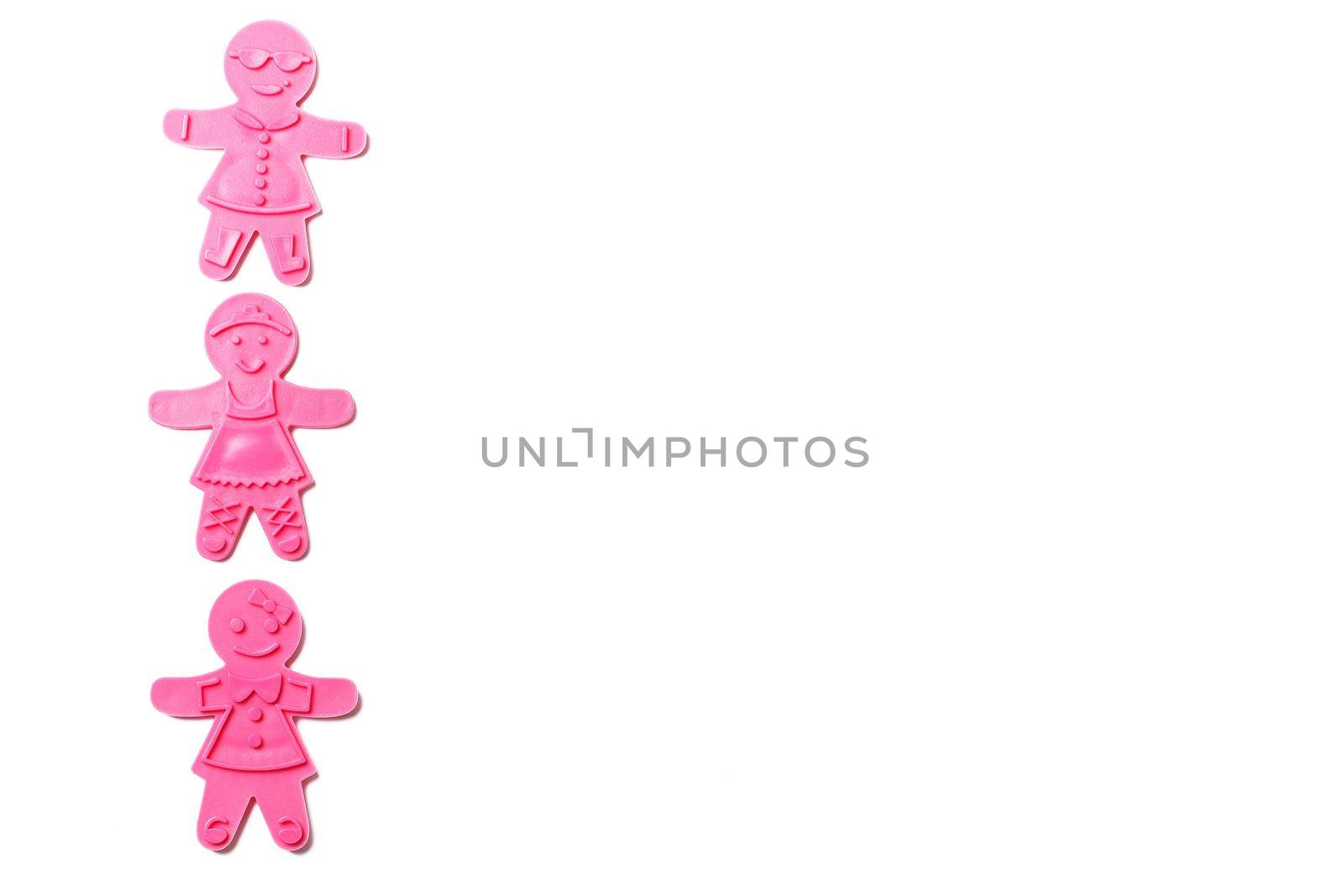 Preparing for Christmas, gingerbread. Stack of gingerbread in the shape of a man and a cutter isolated on a white background. copy space by lara29