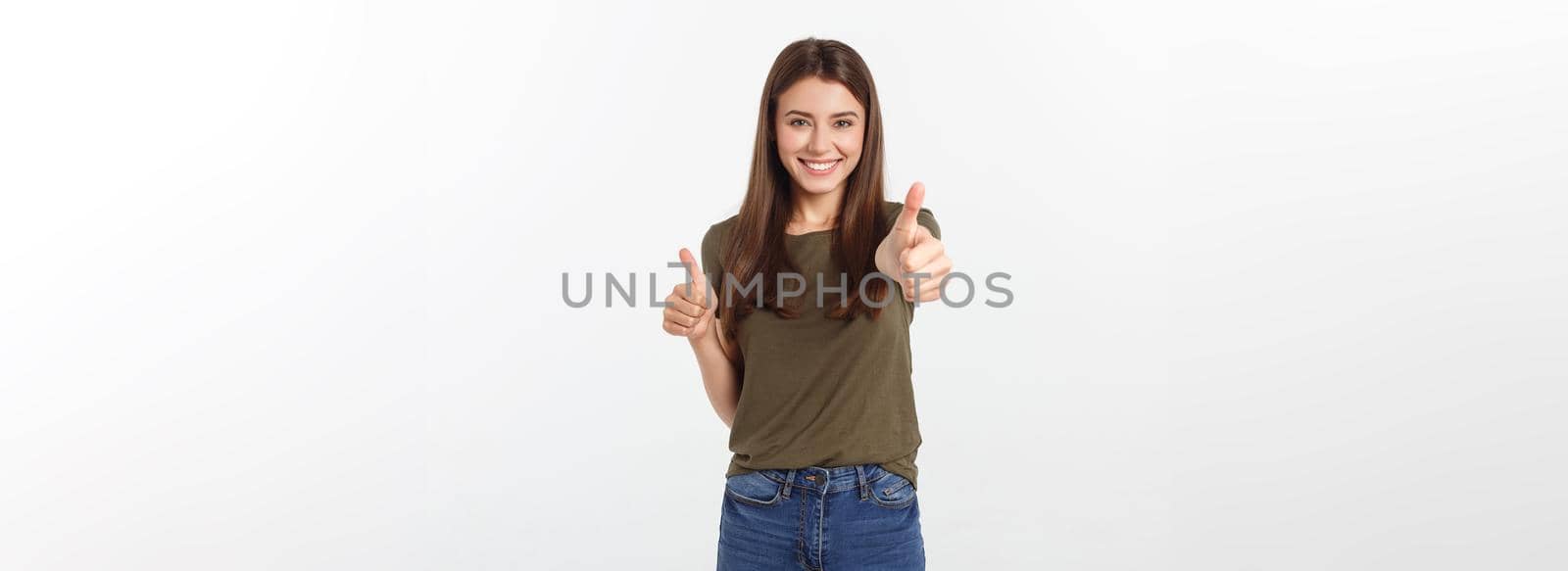 Closeup portrait of a beautiful young woman showing thumbs up sign. Isolate over white background. by Benzoix