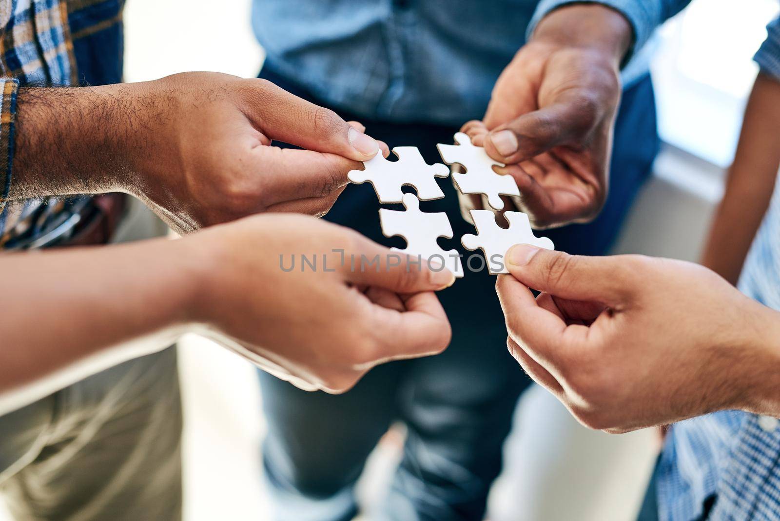 Equally responsible for finding a solution. a work group connecting pieces of a puzzle