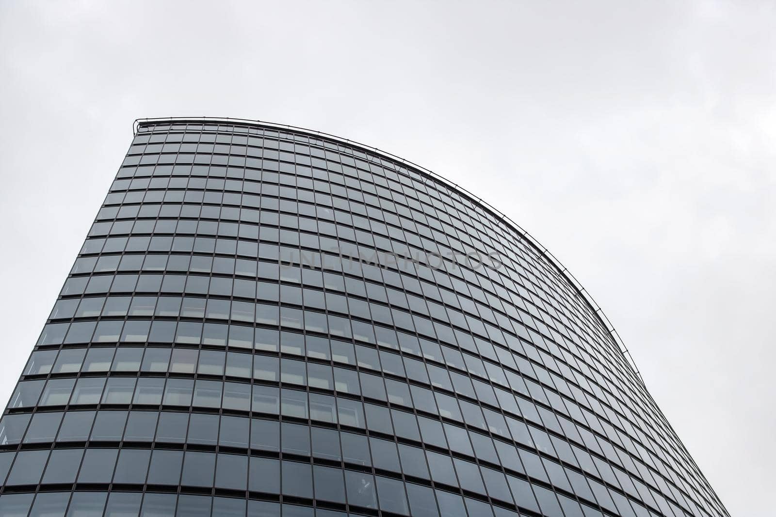 Mirrored windows on a tall modern building close up