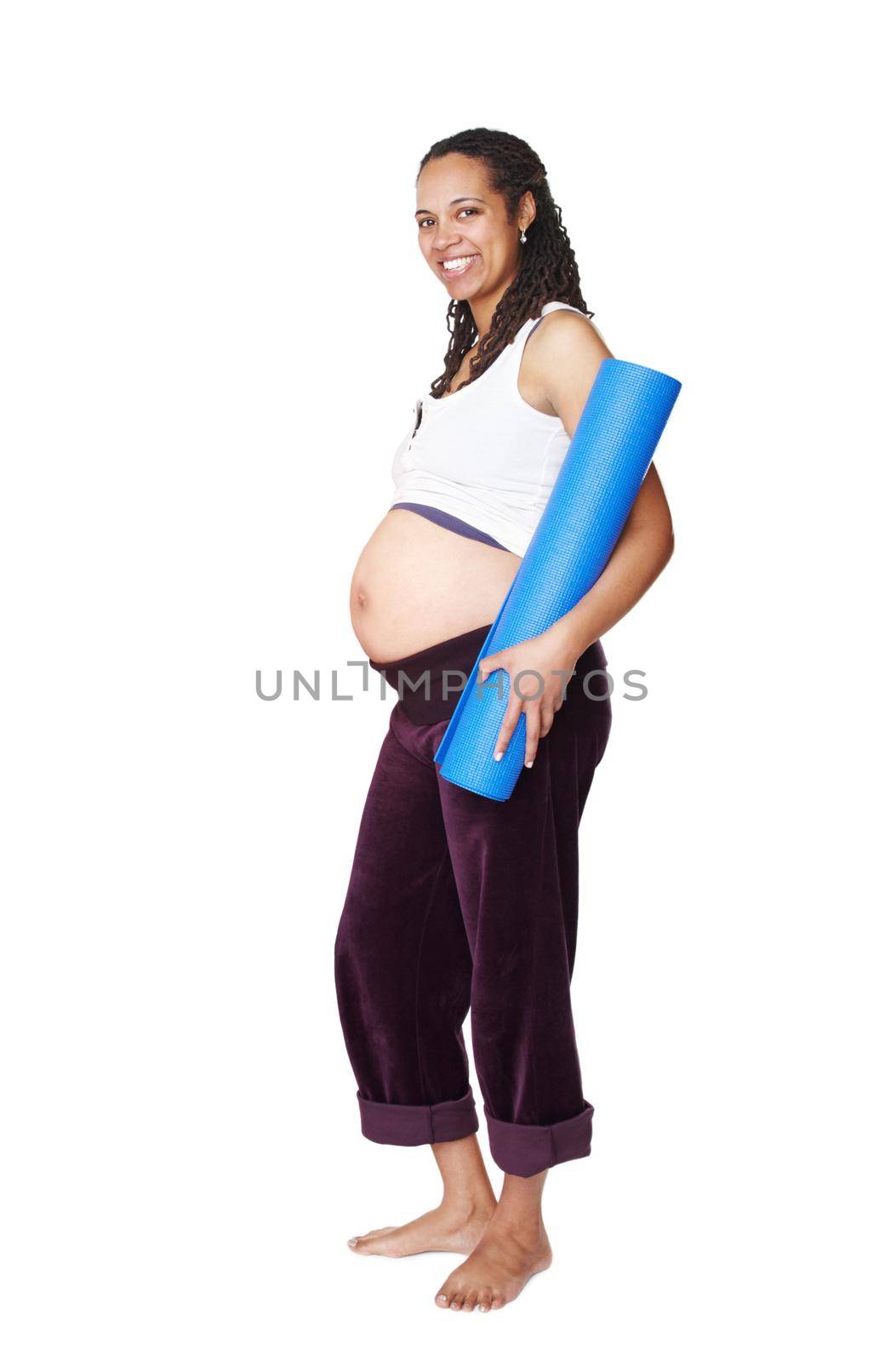 Pregnant, happy and yoga woman in portrait shows pregnancy, healthcare and wellness for her baby. Pilates, fitness and spiritual mother to be with a smile, mat and big stomach in studio for exercise.