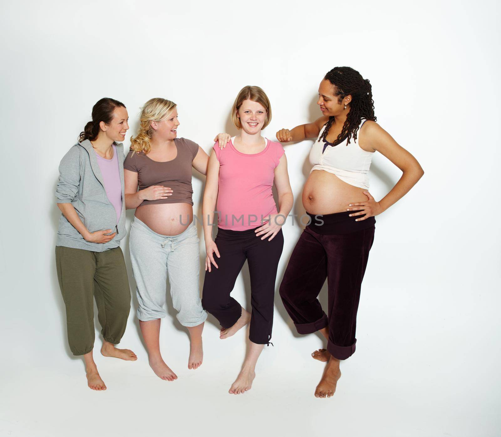 Diversity, pregnant friends and mother in studio with support or trust in pilates, health and yoga clothes in studio. Smile, happy and wellness pregnancy lifestyle with positive women portrait.