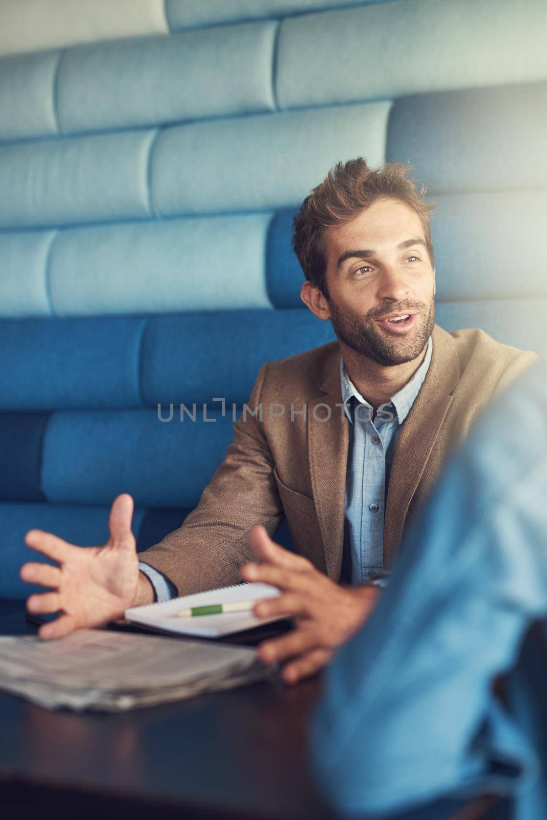 People are his business. a young man having a business meeting in a cafe