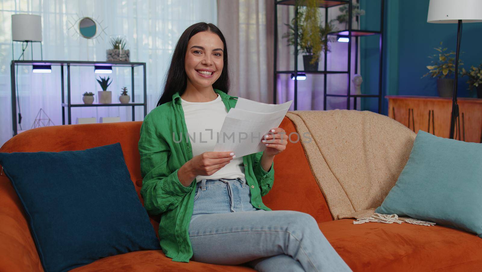 Happy woman open envelope letter, reading it. Career growth advance promotion, bank loan approve, successful admission to university monetary award long-awaited invitation great news, lottery game win