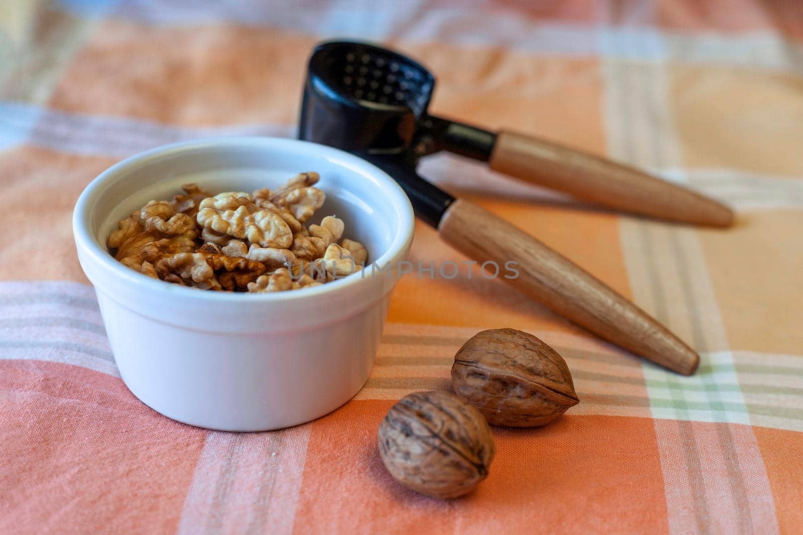 walnuts with a crackers on a table, selective focus