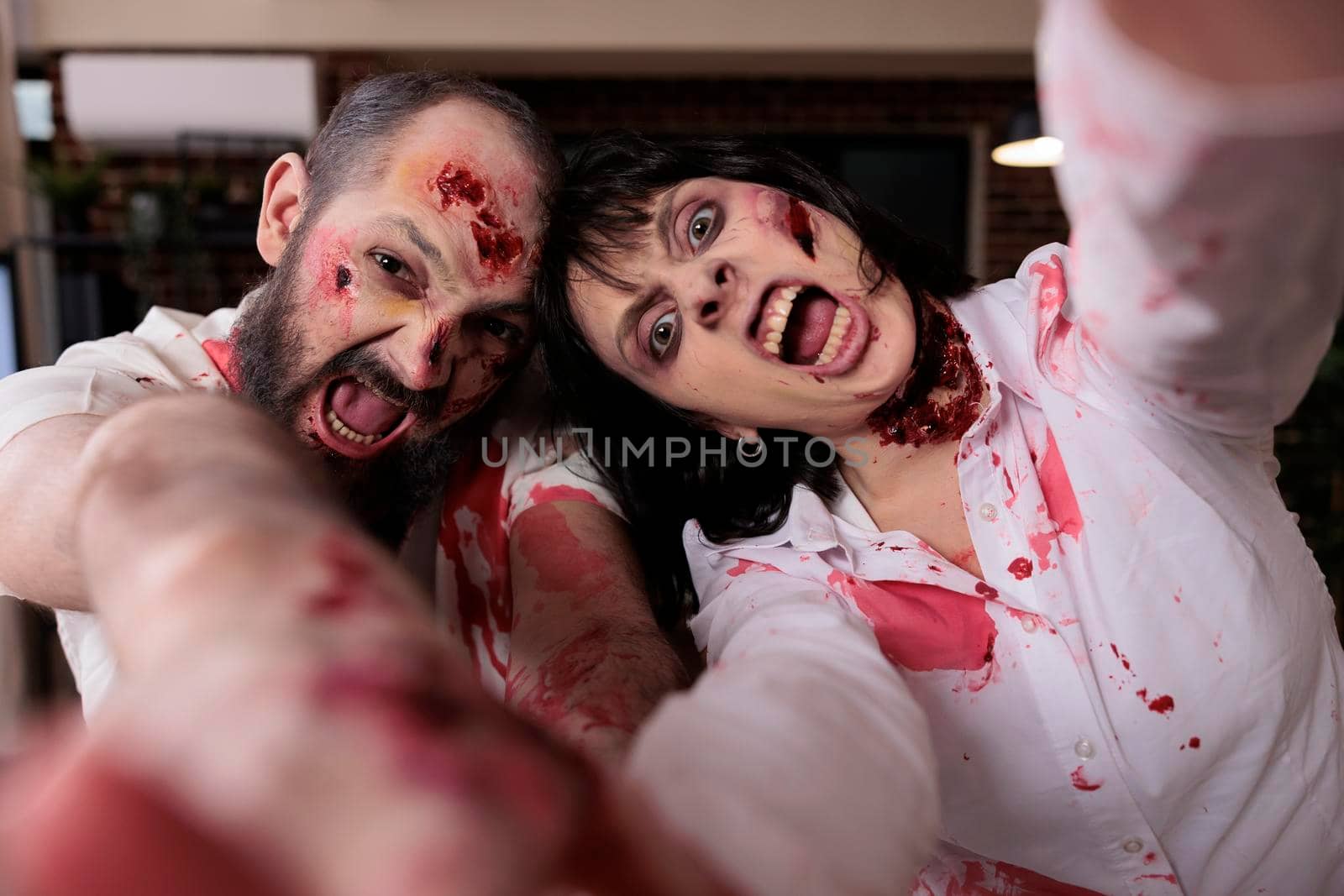 Portrait of scary zombies couple in office by DCStudio