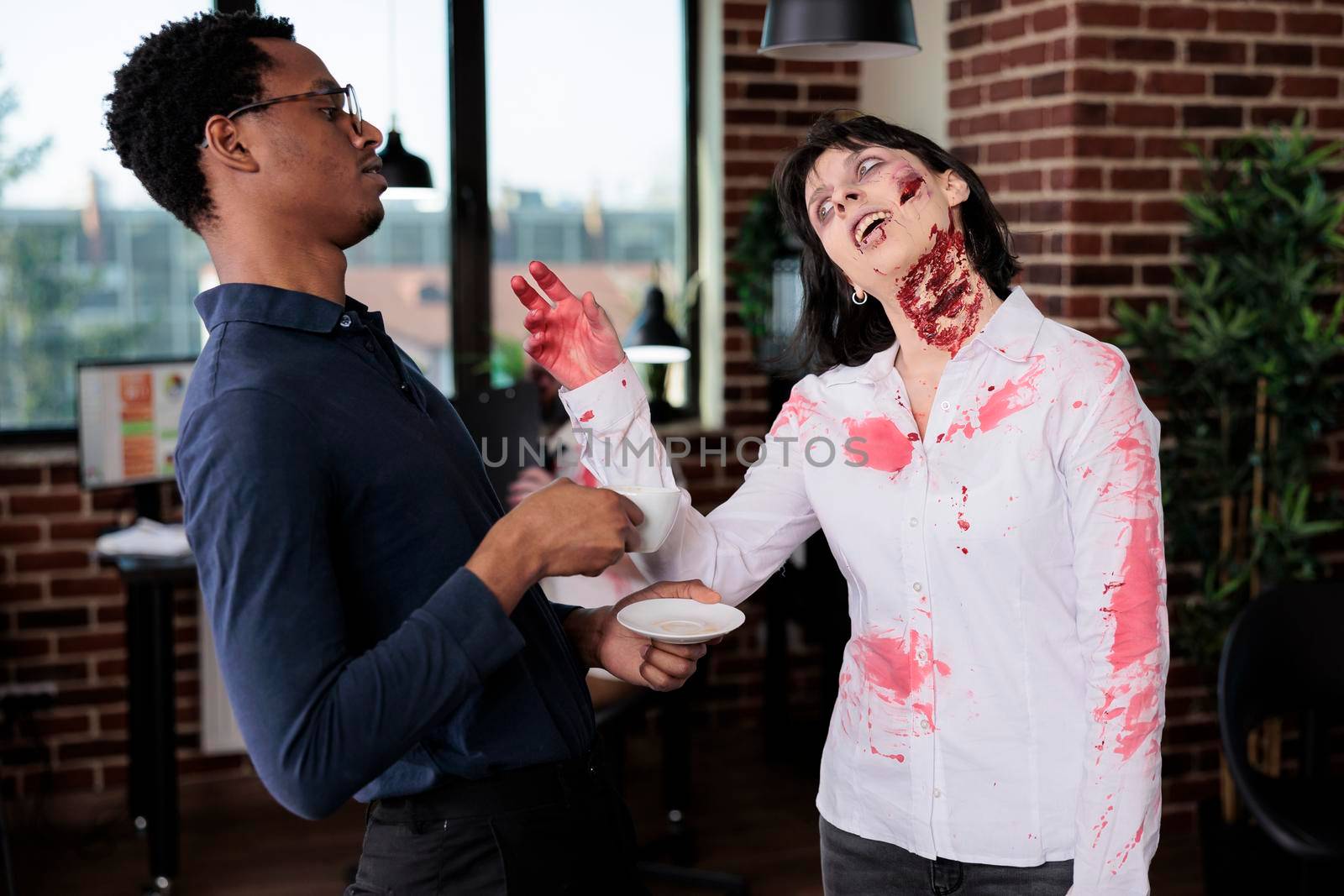 Aggressive zombie chatting with man in office by DCStudio