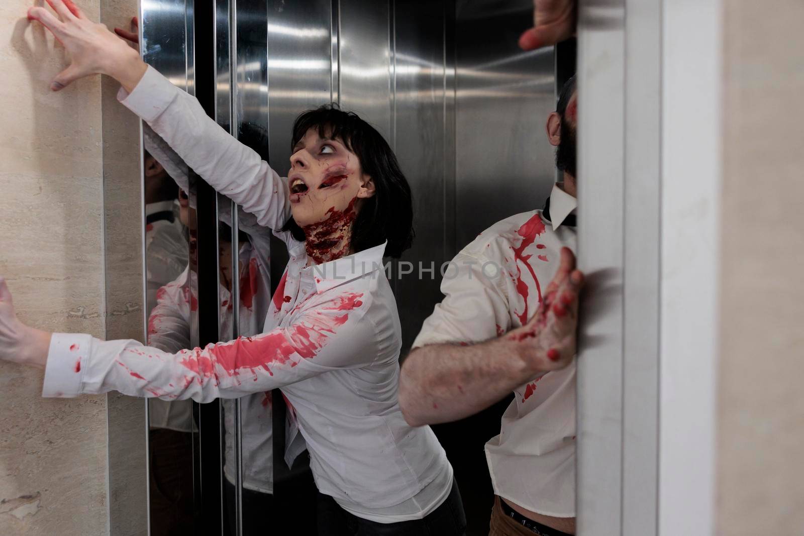 Couple of zombies escaping elevator to attack by DCStudio