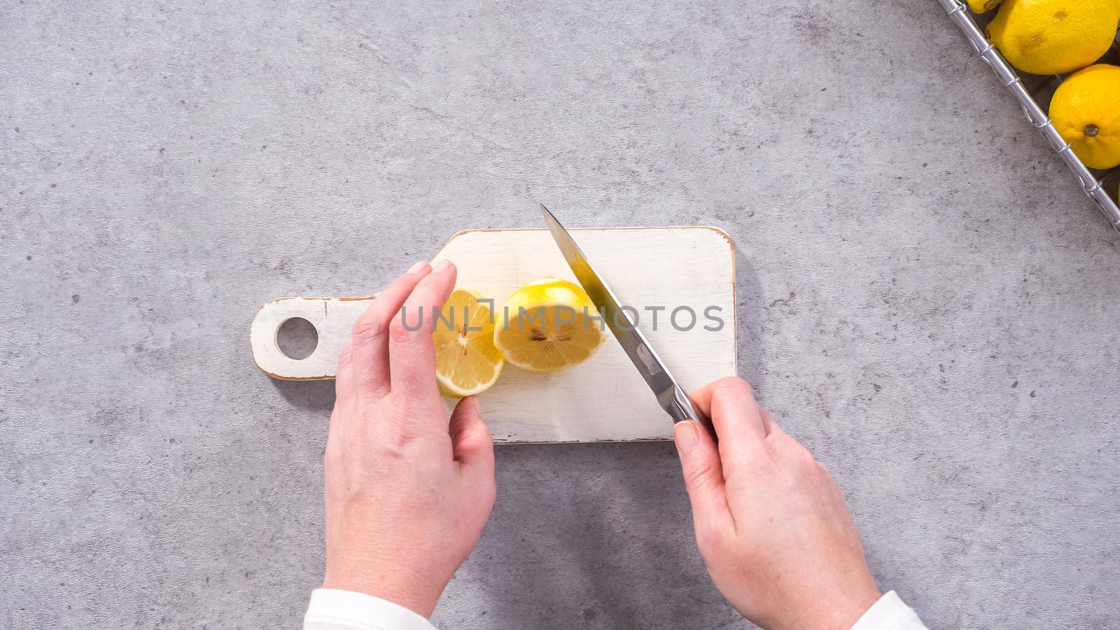 Flat lay. Step by step. Squeezing fresh lemons for baking lemon cranberry bundt cake.