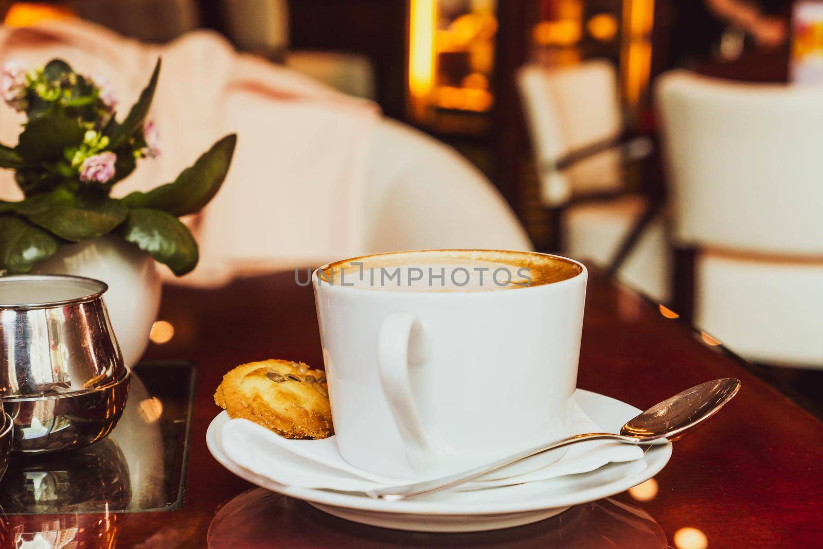Cappuccino in a restaurant, at a coffee break by Anneleven