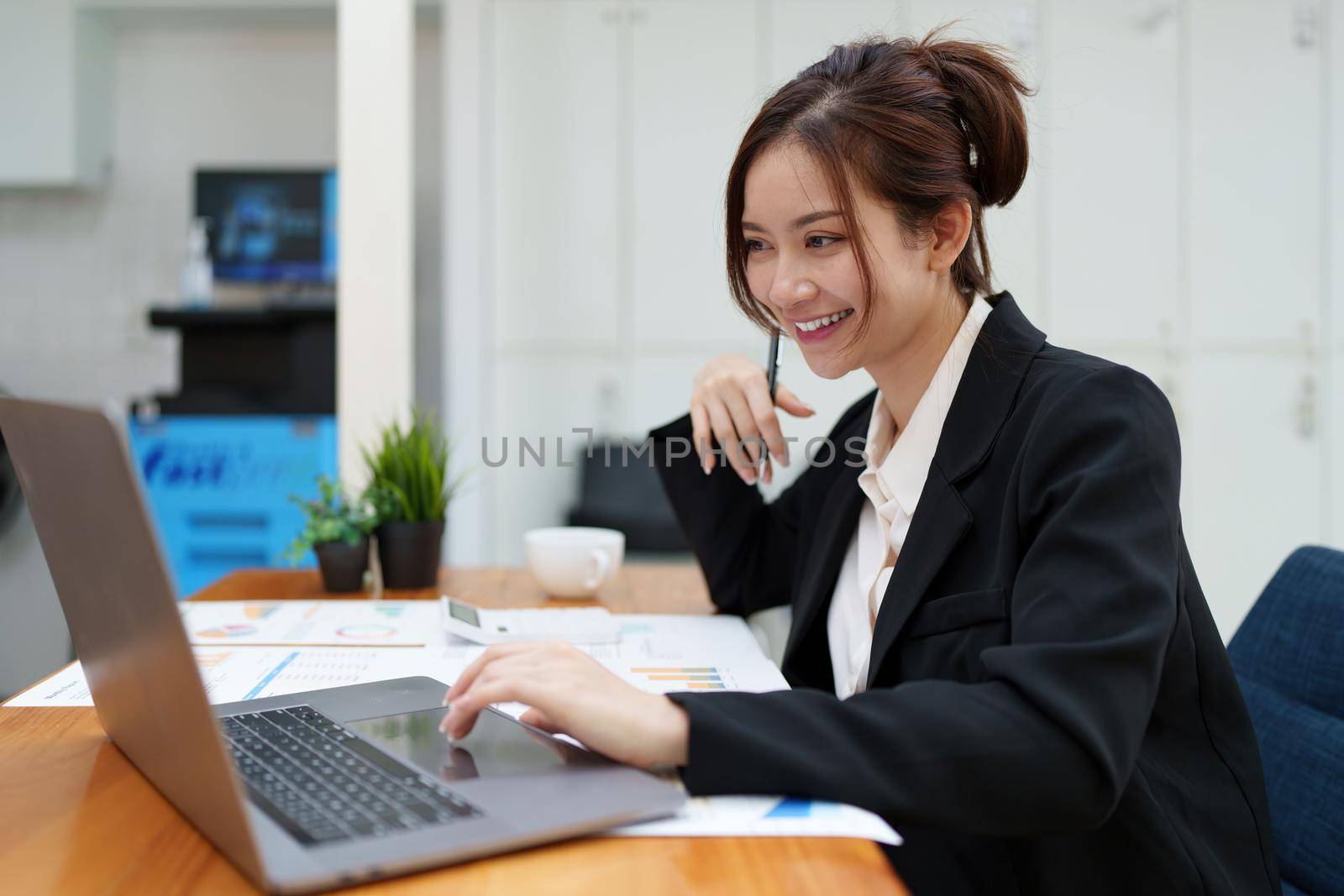 Asian woman have video call meeting with partner by laptop computer by itchaznong