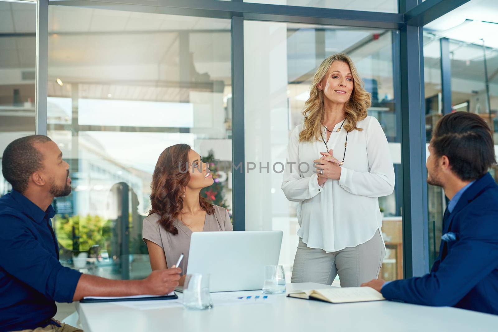 I have some impressing news to share. a group of businesspeople having a meeting in a boardroom