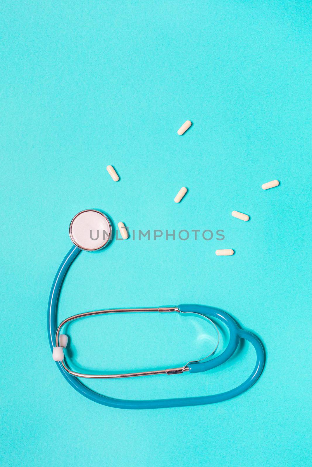 Stethoscope on pastel blue background from above by Ciorba