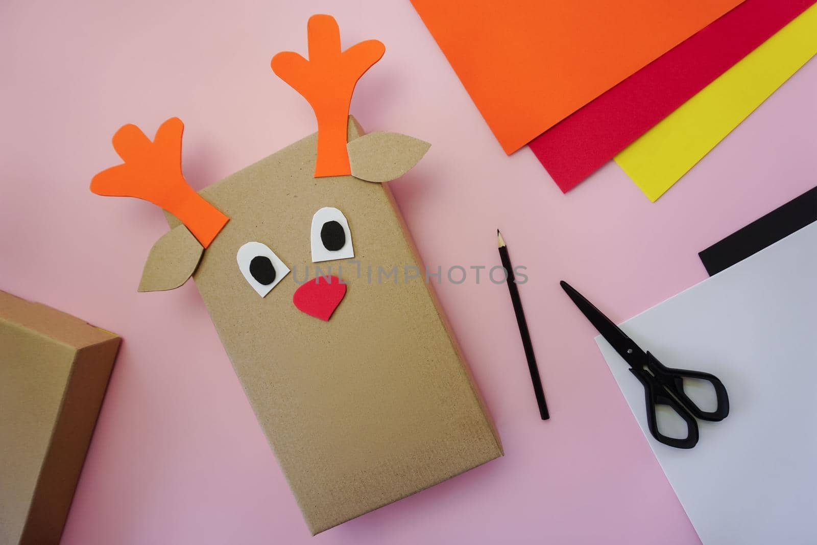 Step 6. Making a gift package in the form of a Christmas deer. High quality photo