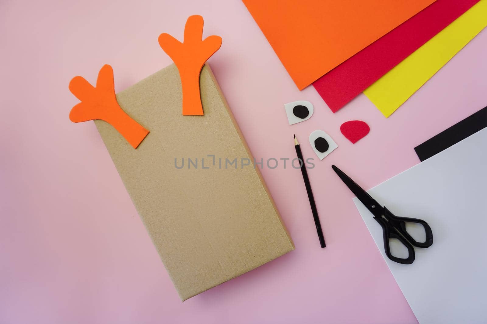 Step 2. Making a gift package in the form of a Christmas deer. High quality photo