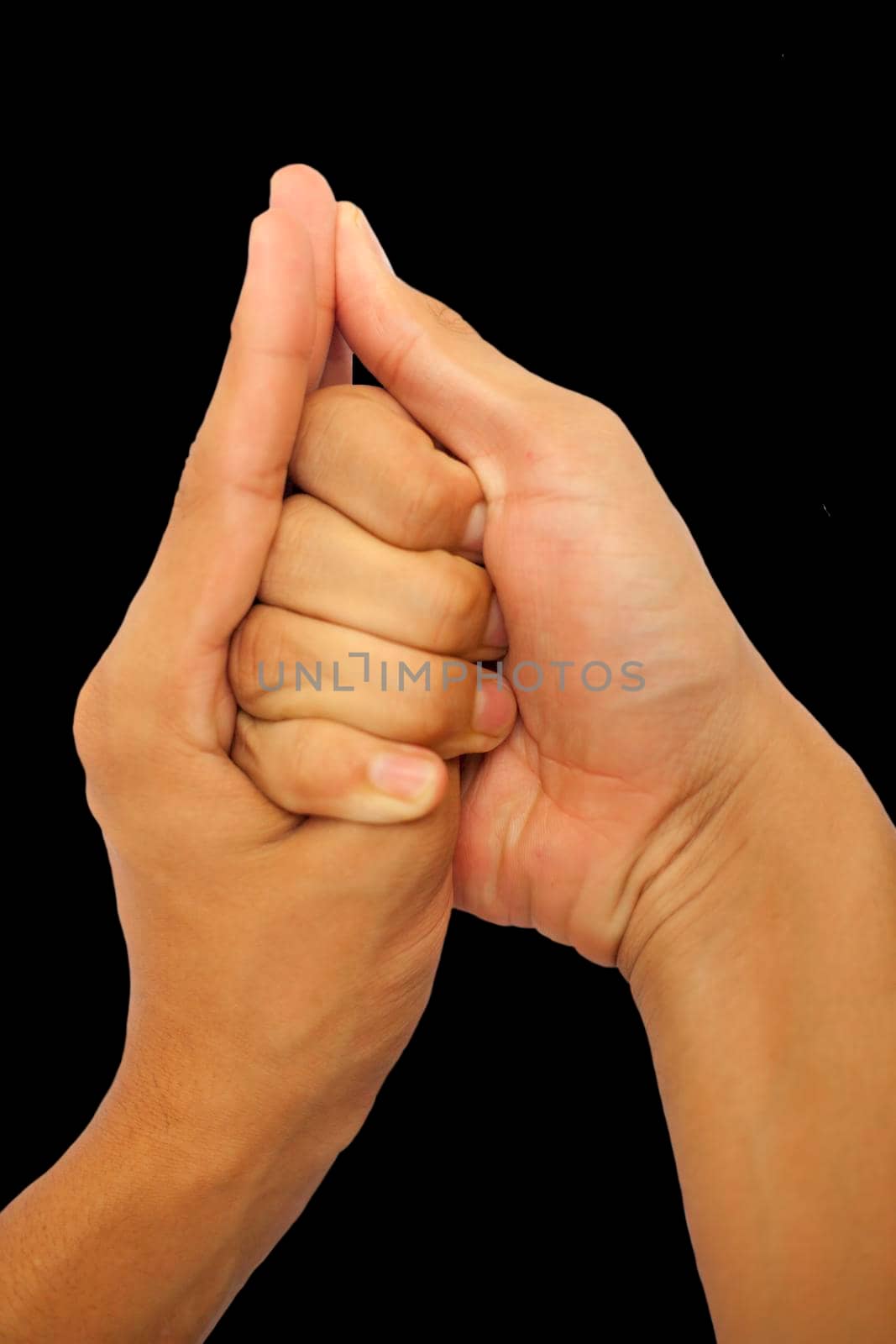 Shot of male hands doing Shankh mudra isolated on black background.