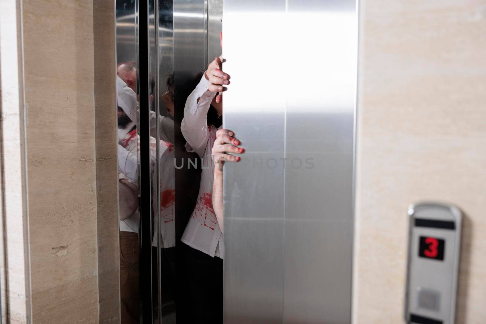 Couple of angry zombies escaping elevator by DCStudio