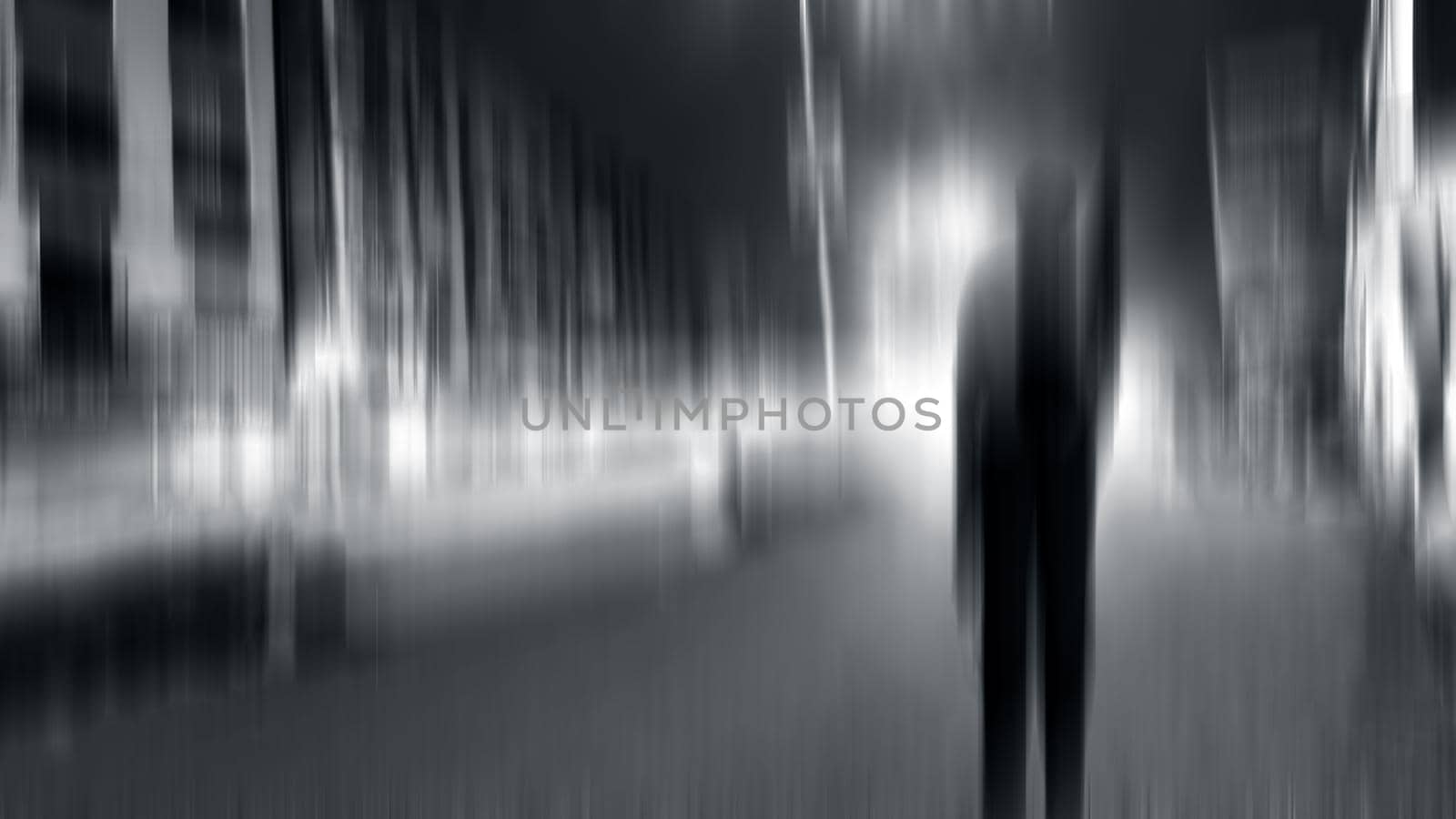 motion blur image of a man standing on road at night time. by mirzamlk