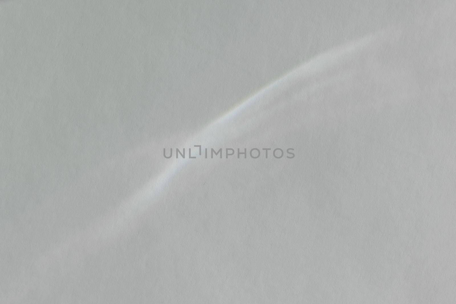 Caustic effect light refraction on white wall overlay photo mockup, blurred sun rays refracting through glass prism with shadow. Abstract natural light refraction silhouette on water surface by photolime