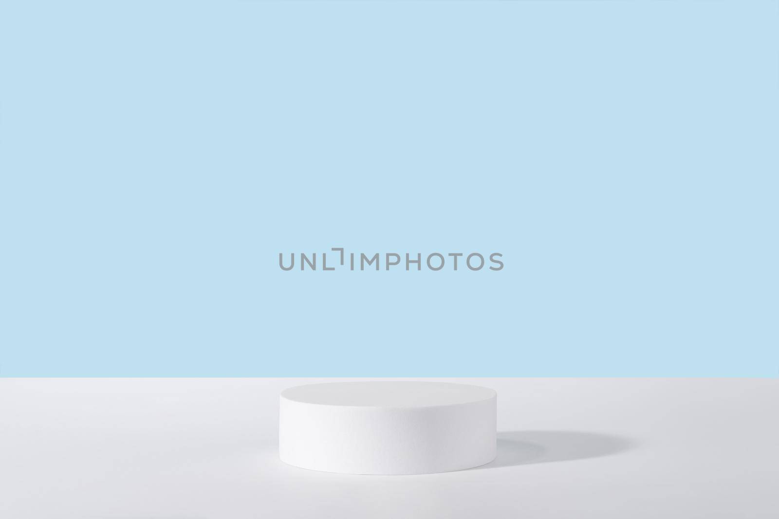 Showcase for jewellery presentation, white platform for perfume advertising, cosmetics stand background, branding scene mockup. Podium pedestal for cosmetic product packaging on blue. by photolime