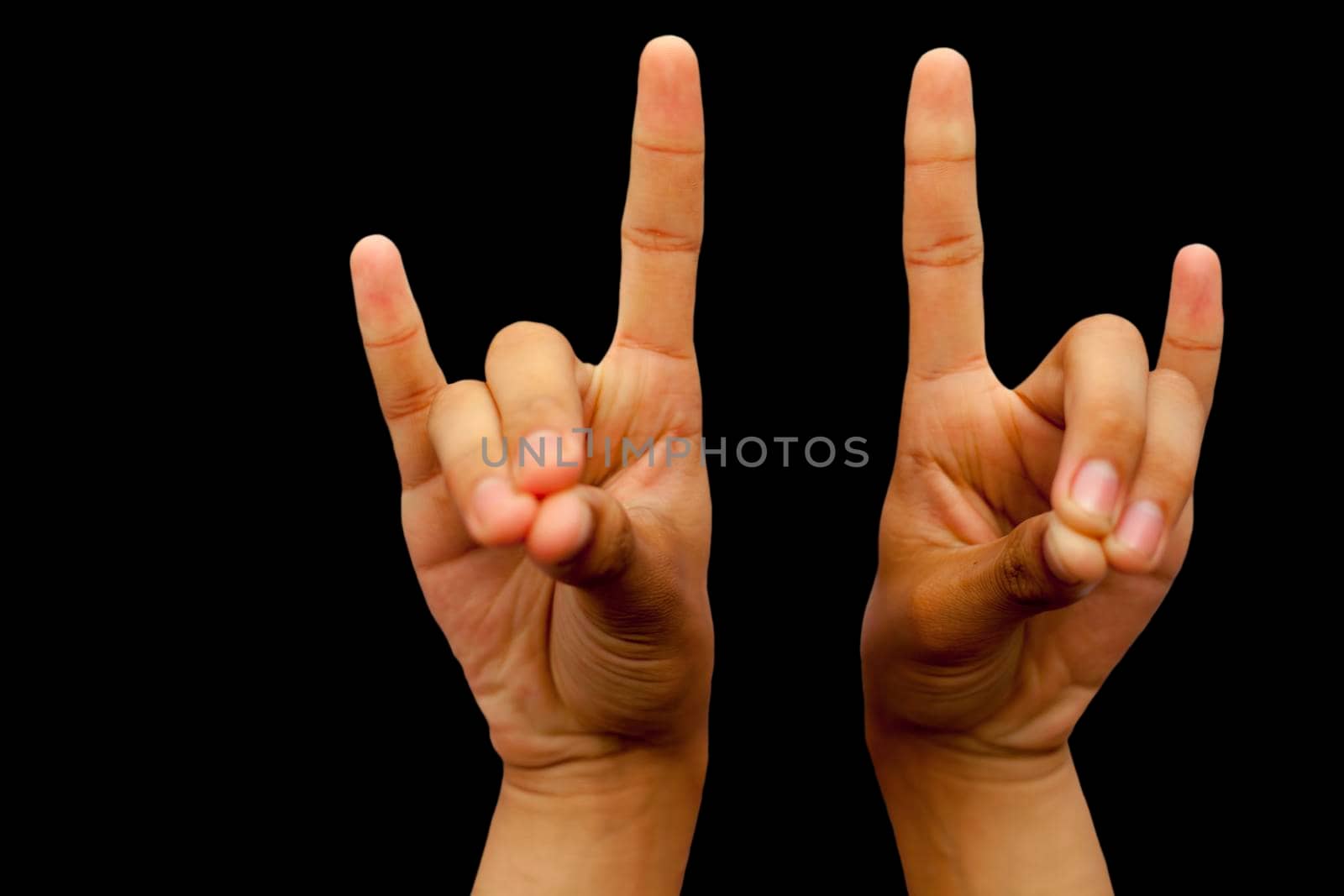 Shot of male hands demonstrating Apana mudra with two hands isolated on a black background. by mirzamlk