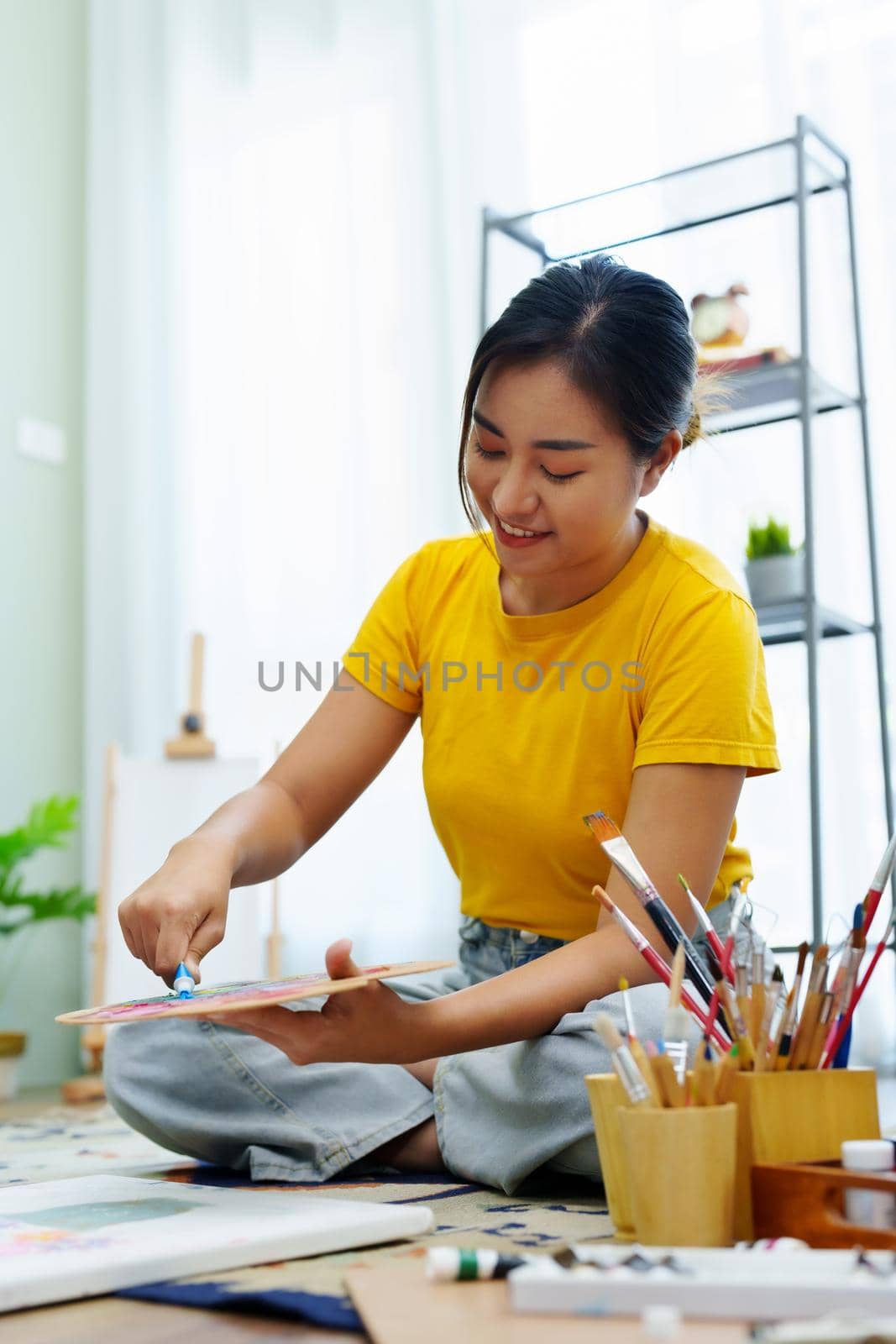 Portrait of an Asian woman designing art in her spare time. by Manastrong