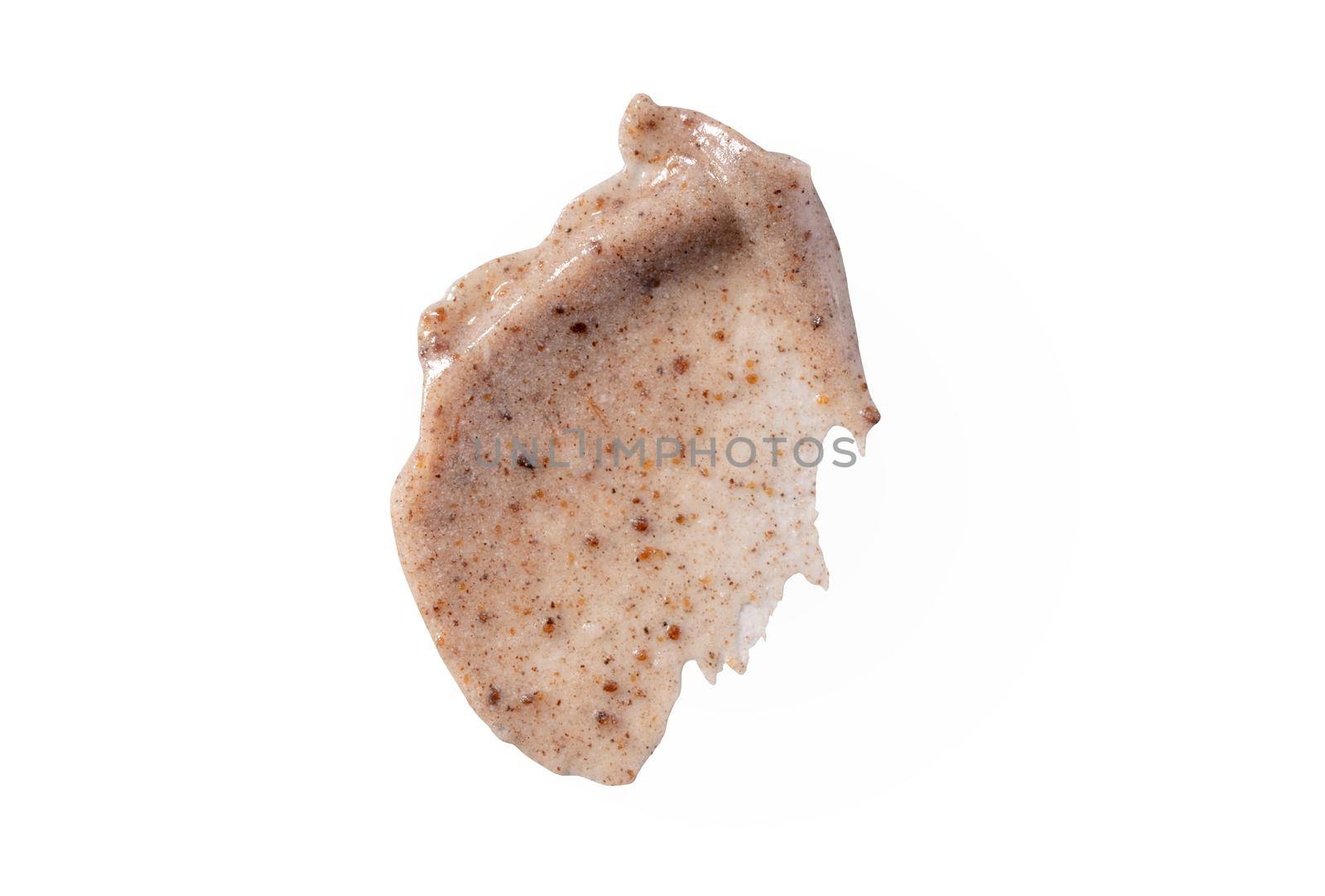 Scrub smear swatch isolated on white background. Peeling cream smudge with exfoliating particles, cosmetic skincare product with abrasive particle sample, gentle nude scrub texture isolate