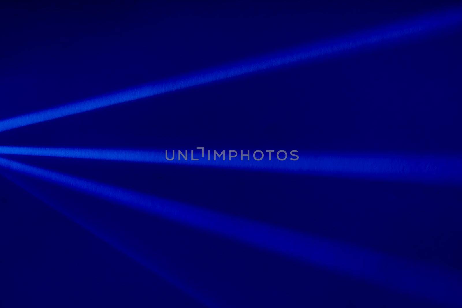 Blue light flare prism rainbow flares overlay effect on black background, light crossing crystals, prismatic sun catcher reflections rays. Abstract blurred colourful lens flare bokeh on dark backdrop