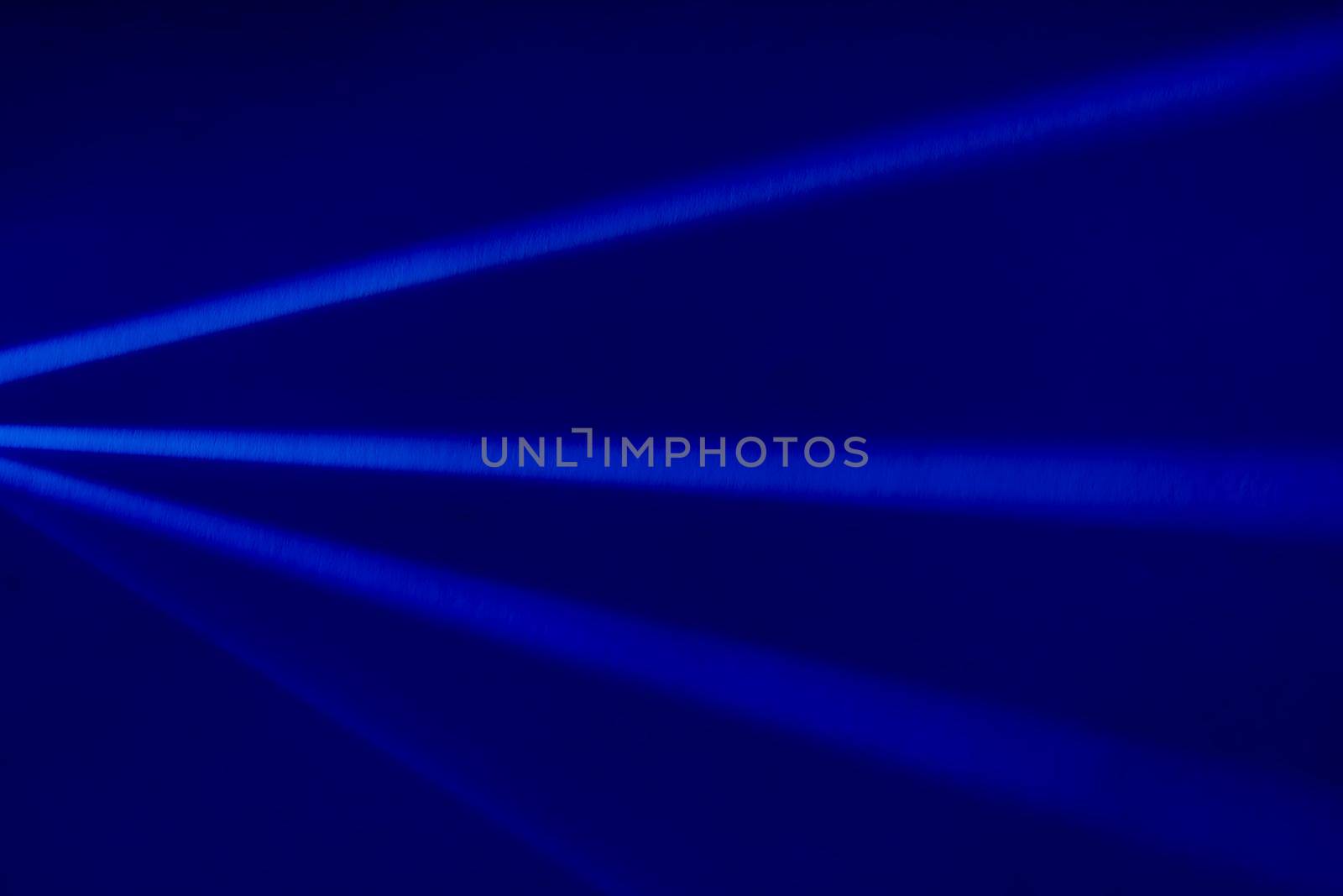 Blue light flare prism rainbow flares overlay effect on black background, light crossing crystals, prismatic sun catcher reflections rays. Abstract blurred colourful lens flare bokeh on dark by photolime